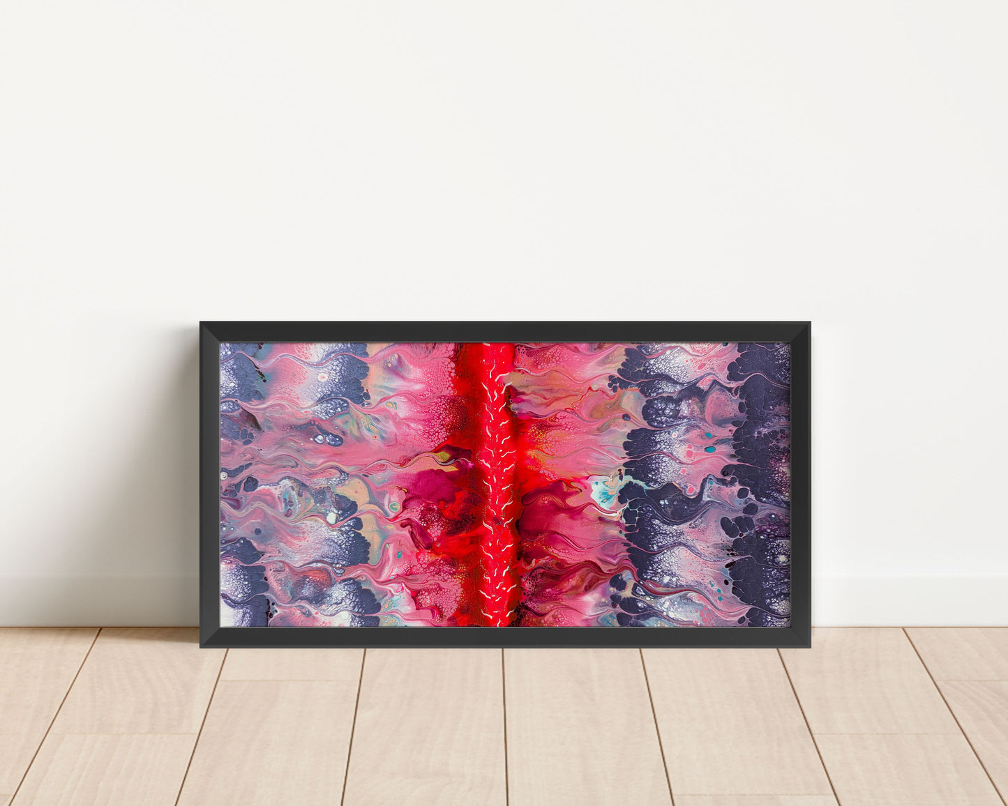 Framed abstract painting resting against a white wall on a light wood floor, featuring swirling purple, and pink tones with a bold neon pink center line.