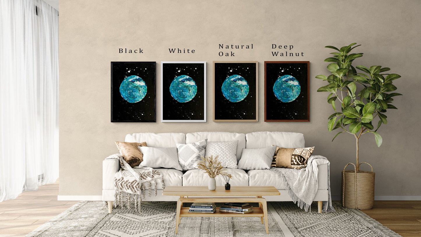 Four framed prints of Abby May Art’s painting “Blue Moon” displayed above a cream sofa in a modern living room. The artwork features a turquoise and teal marbled moon against a black starry background with white speckled stars. Each print shows a different frame color—Black, White, Natural Oak, and Deep Walnut—labeled above each frame. The scene includes cozy neutral throw pillows, a wood coffee table, and a potted plant, helping viewers see how the artwork looks in a home setting.