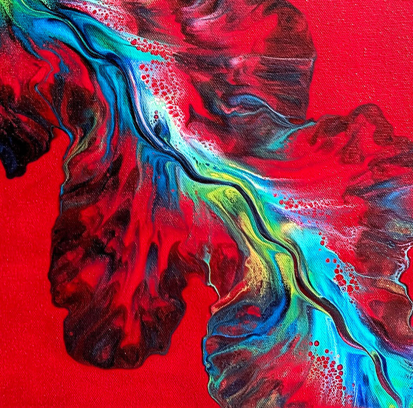 Detail of Elemental Surge abstract painting, showing vivid red background with flowing blue, teal, and yellow streaks
