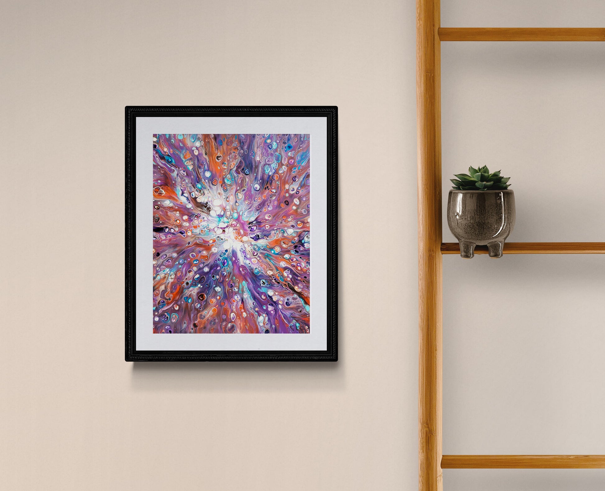 Framed Elusive Kitsune fluid art print styled on a modern shelf, blending fiery orange and purple tones.