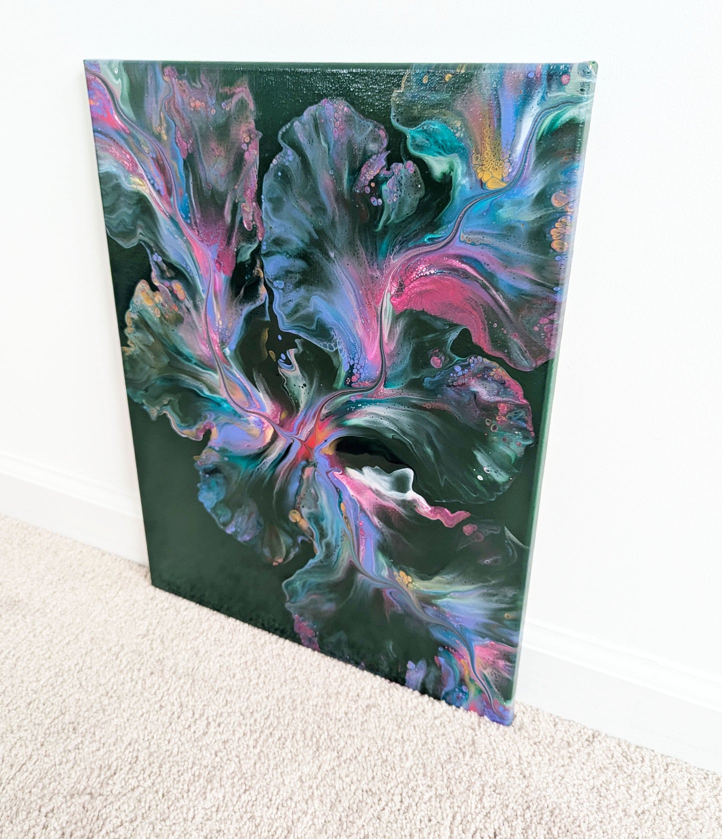 A dreamy abstract fluid painting titled 'Enchanted Sky,' showcasing a lush green background with soft blends of pinks and purples. The organic movement of color creates a magical and ethereal sky-like effect