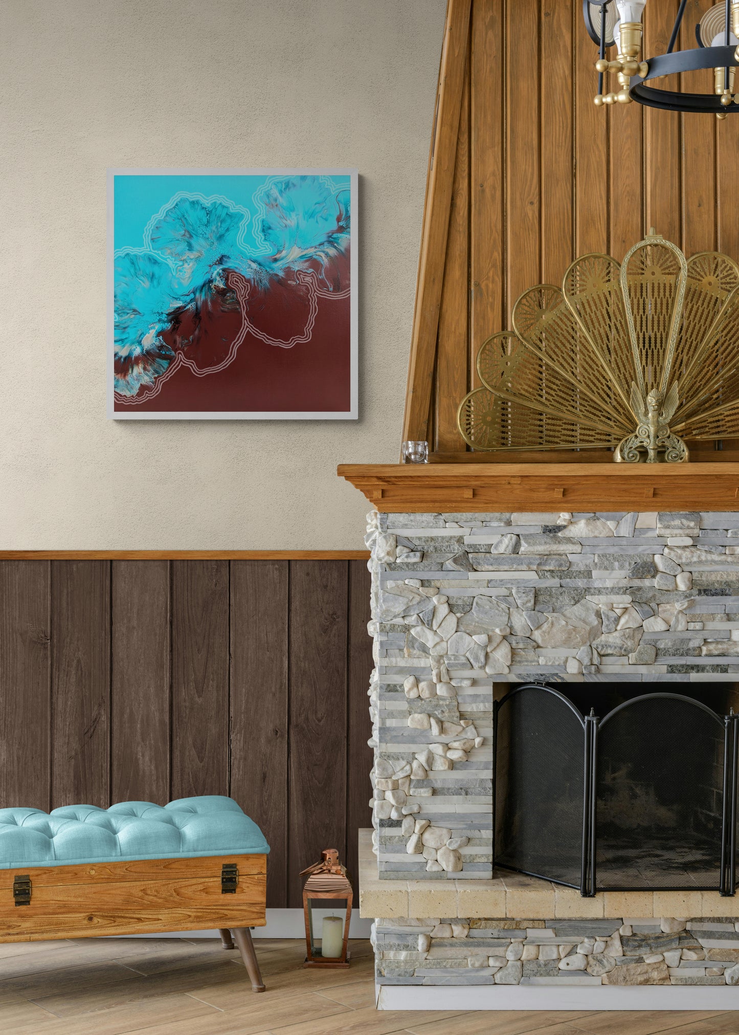 Growth & Change painting styled above a stone fireplace in a cozy living space with warm wood accents and a tufted teal bench
