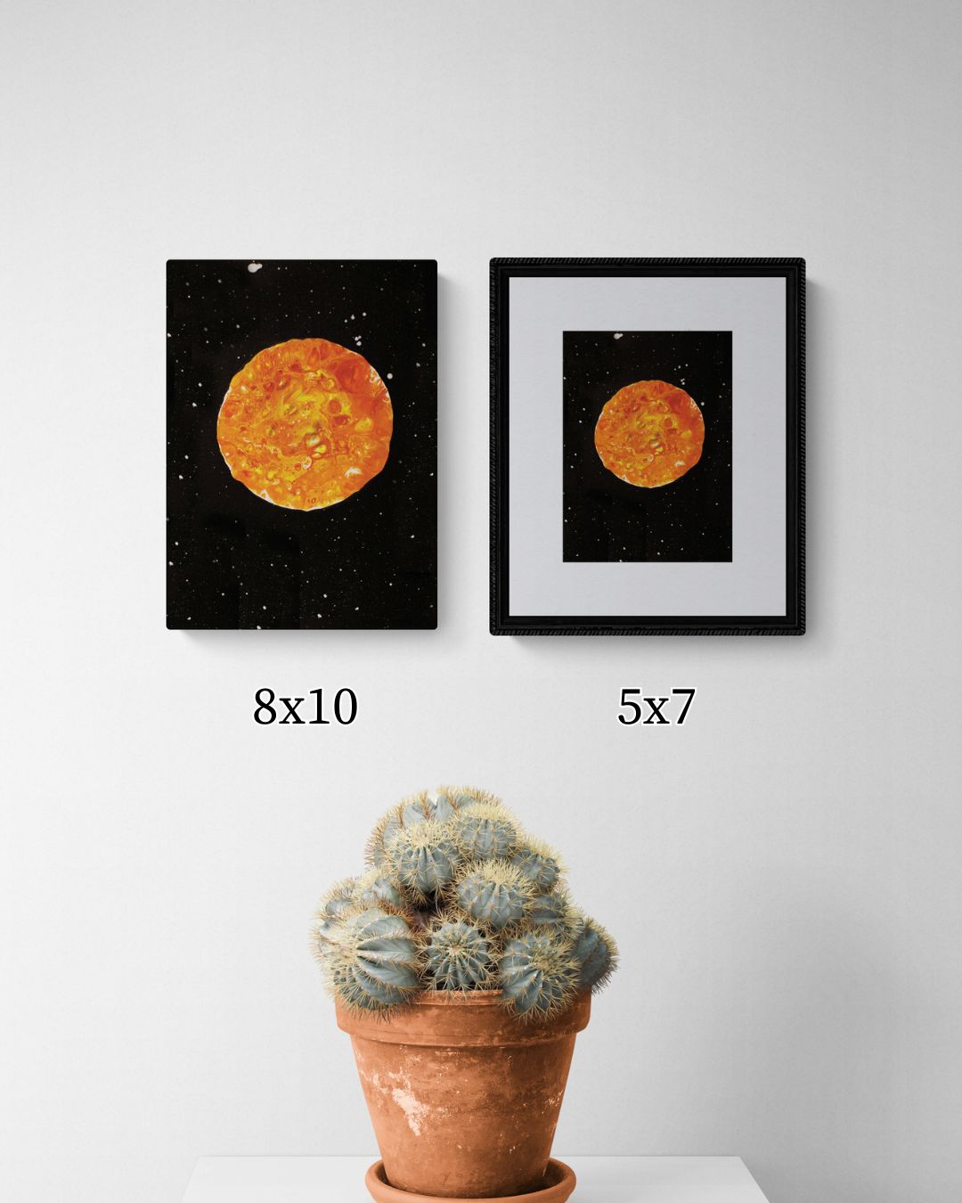 Side-by-side comparison of 5x7 and 8x10 Harvest Moon art prints, styled with a cactus in a terracotta pot against a white wall