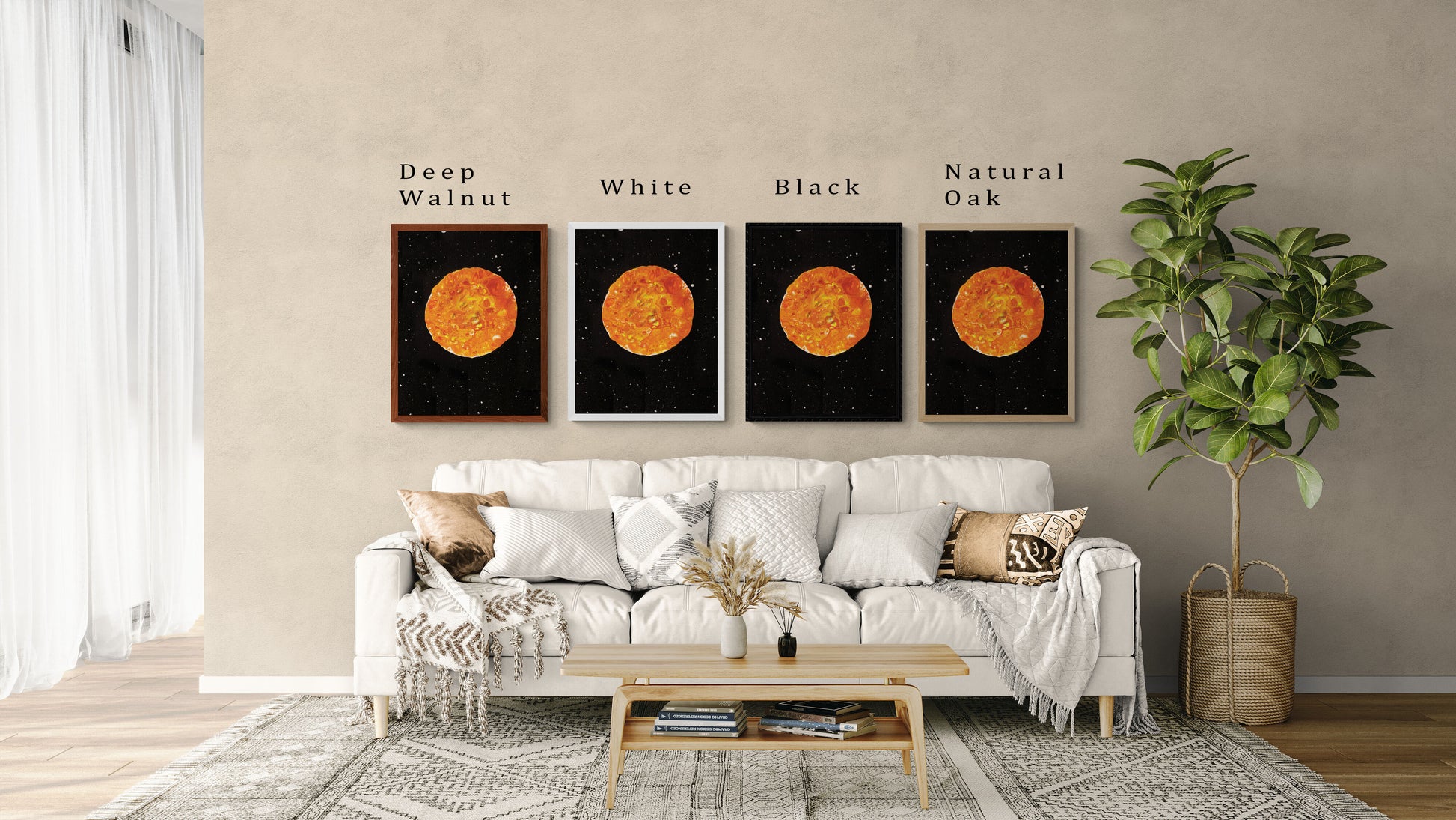 Four framed prints of Abby May Art’s painting “Harvest Moon” displayed above a cozy cream-colored sofa in a modern living room. The artwork features a glowing orange and golden-yellow moon with textured fluid patterns, set against a black starry night sky. Each frame shows a different color option—Deep Walnut, White, Black, and Natural Oak—with labels above each. Neutral pillows, a woven throw, a wooden coffee table, and a potted plant complete the space, helping customers visualize how the art will look in
