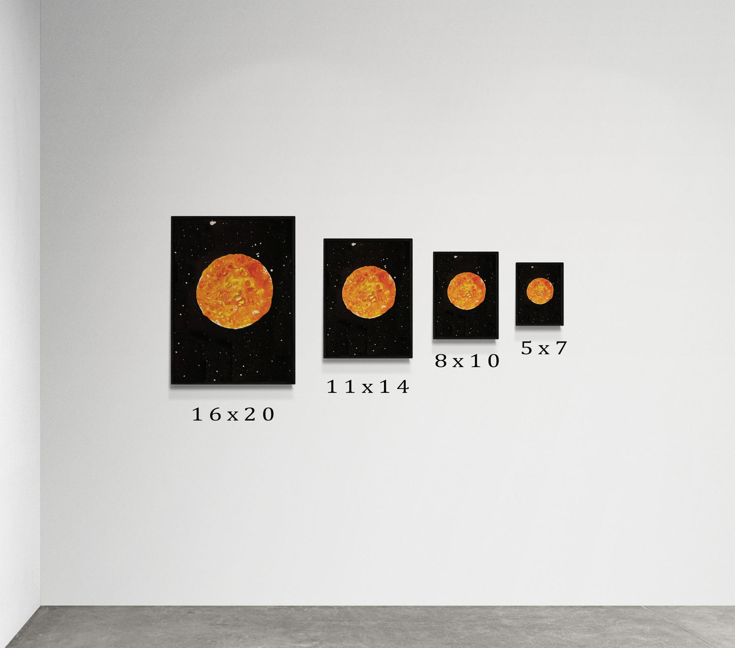 Side-by-side display of Abby May Art’s “Harvest Moon” painting in four different print sizes—16x20, 11x14, 8x10, and 5x7—each in a black frame. The artwork features a warm orange moon floating against a black star-filled sky. Prints are shown on a minimalist white wall with size labels beneath each frame to clearly demonstrate scale.