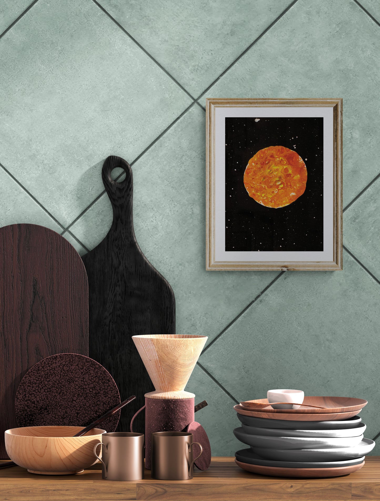 Harvest Moon art print in a gold frame on a teal tiled wall, styled with wooden dishes, mugs, and kitchen decor