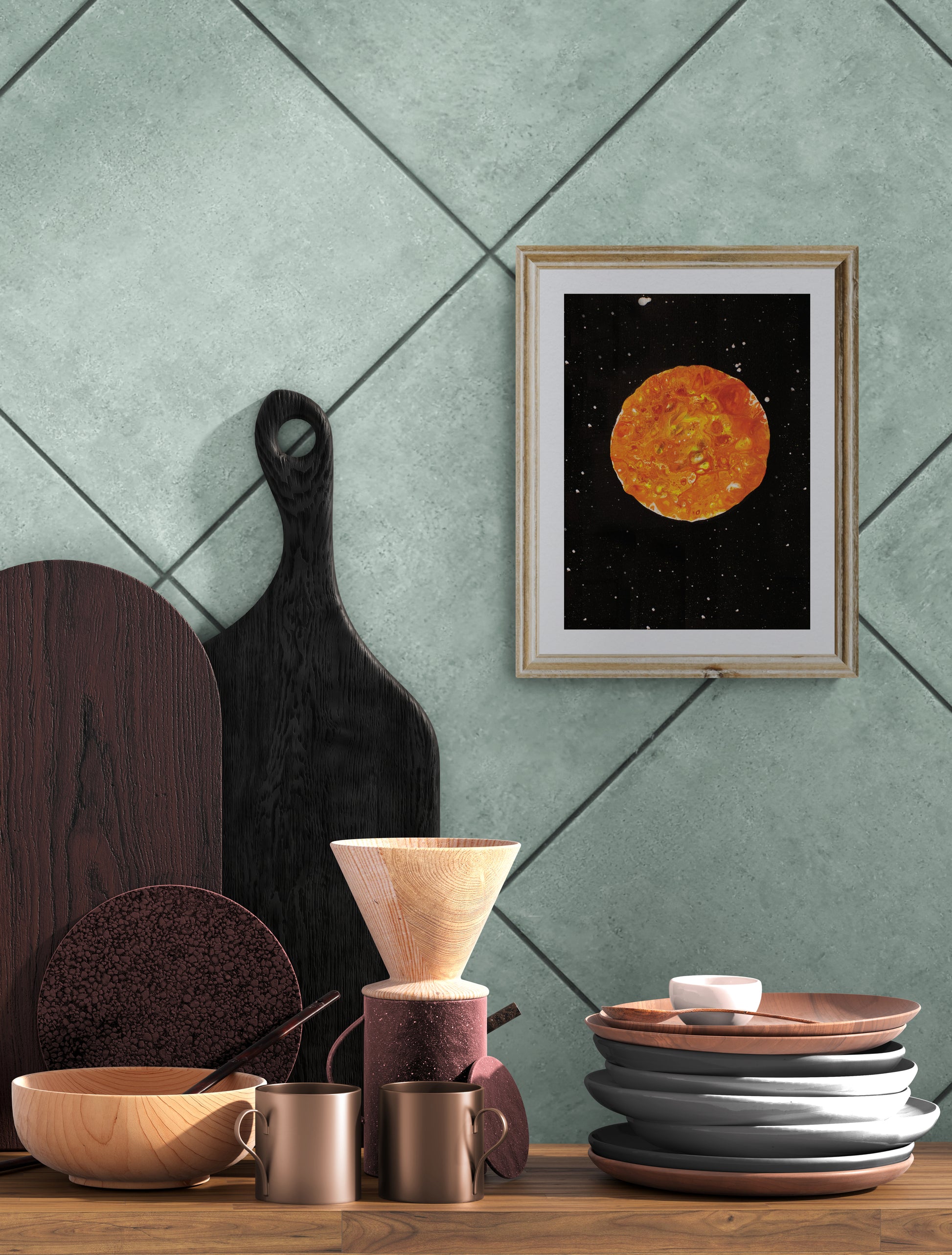 Harvest Moon art print in a gold frame on a teal tiled wall, styled with wooden dishes, mugs, and kitchen decor