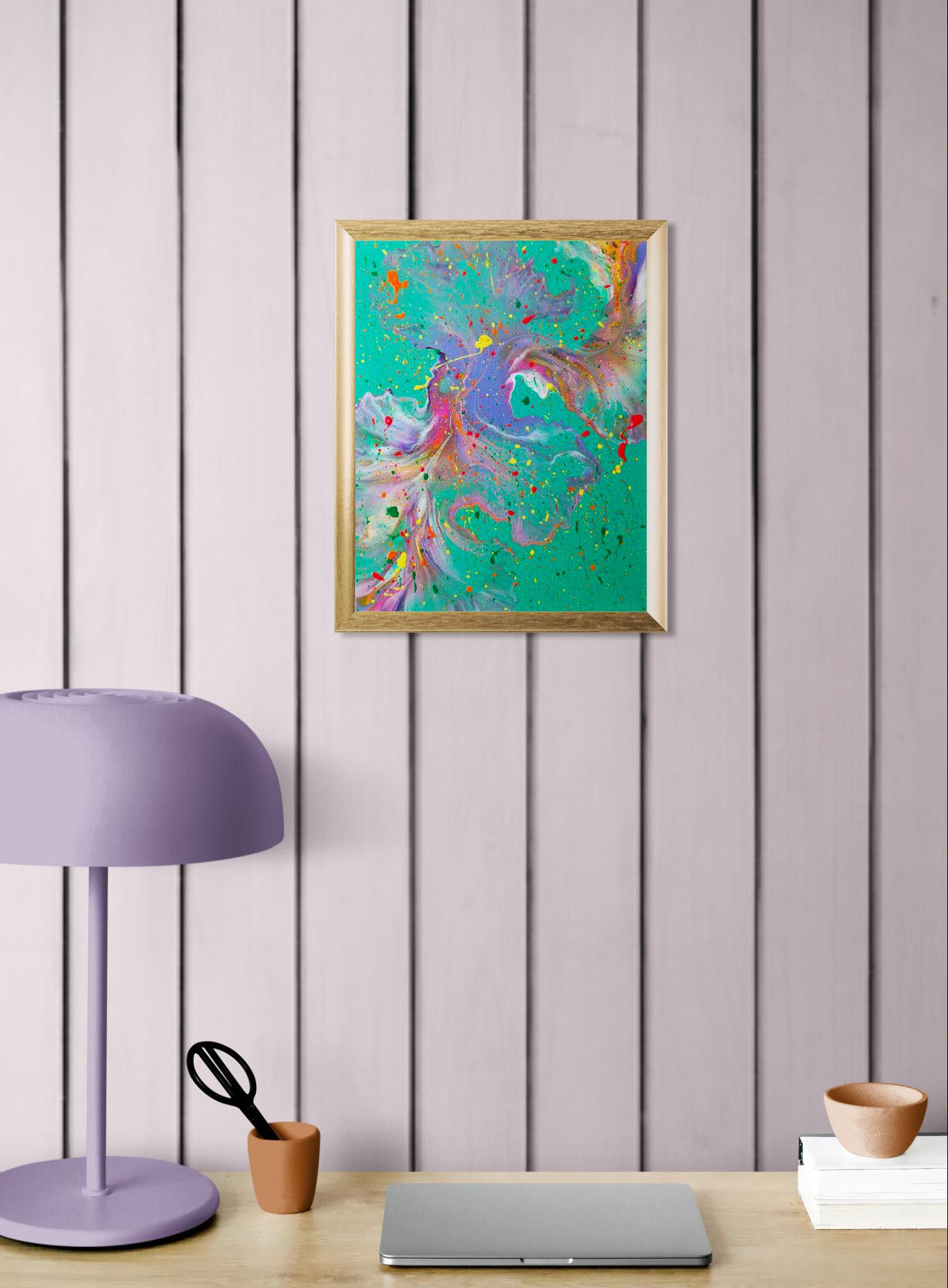 'Have You Lost Weight?' abstract painting in a gold frame on a lavender-paneled wall above a desk setup with a laptop, purple lamp, and minimalist decor.