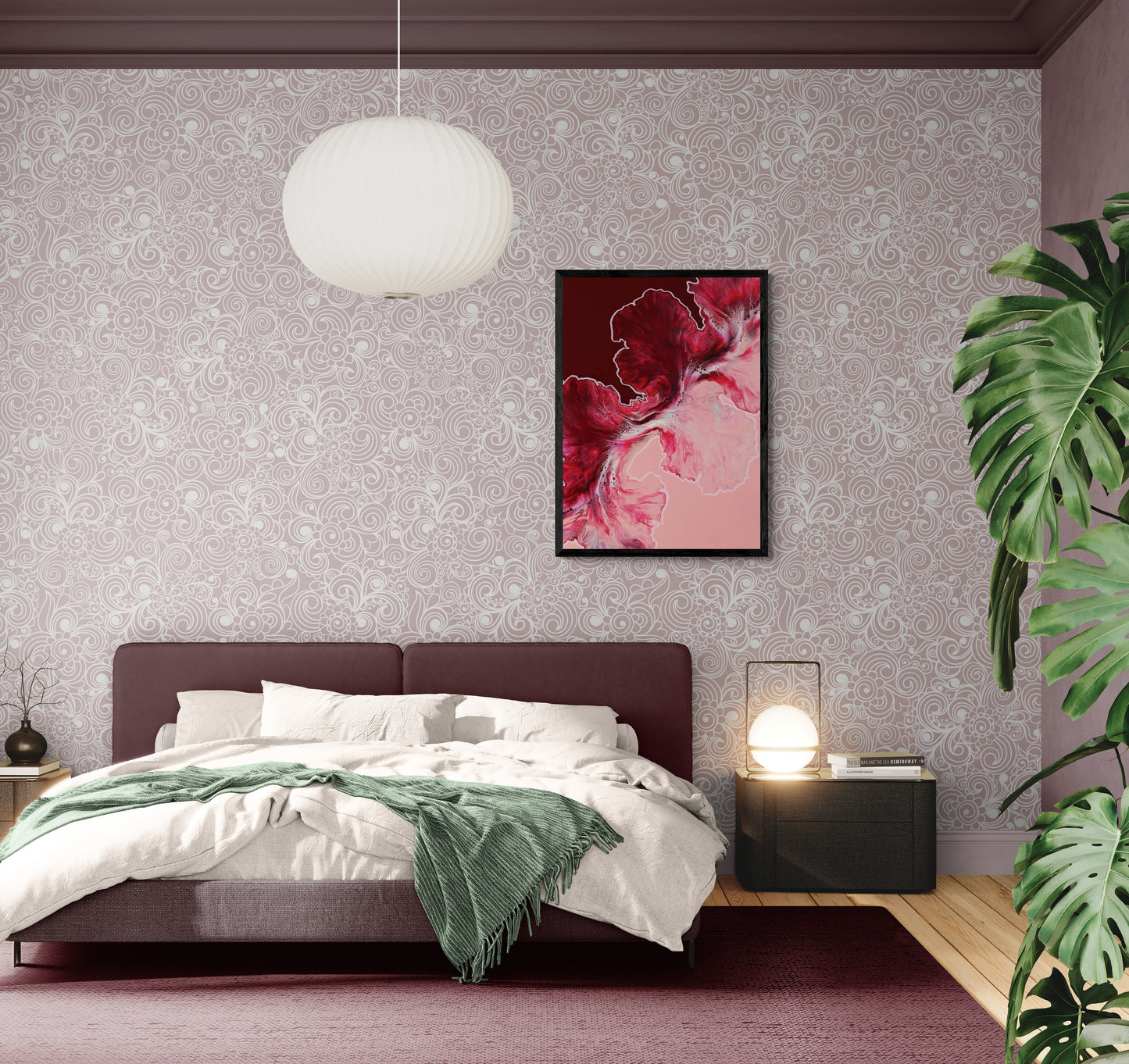 A framed abstract canvas print titled “Hold the Line” hangs above a mauve bed with white bedding and a green throw. The artwork features deep crimson, rose, and blush tones flowing across the canvas, adding warmth and passion to the softly patterned bedroom.