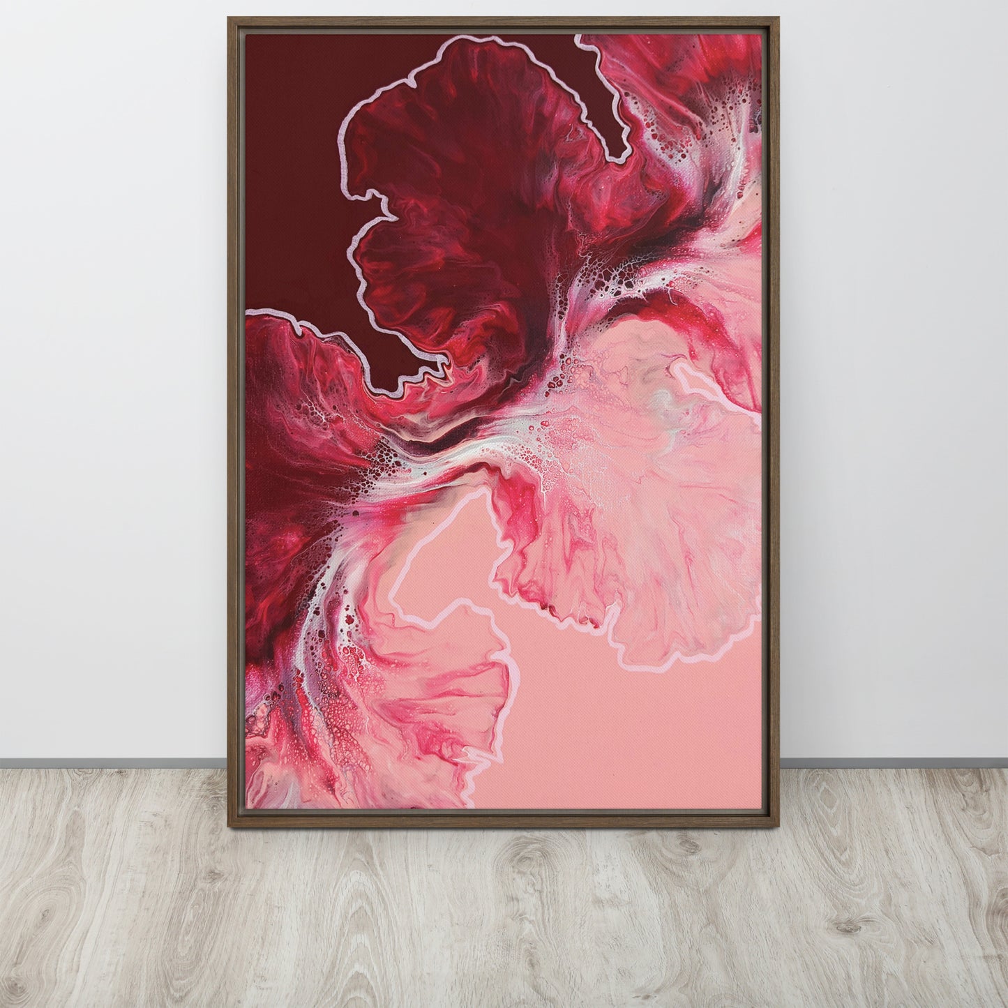 "Hold The Line" acrylic fluid art canvas print in a brown floating frame, featuring bold red and pink abstract swirls with soft white accents.