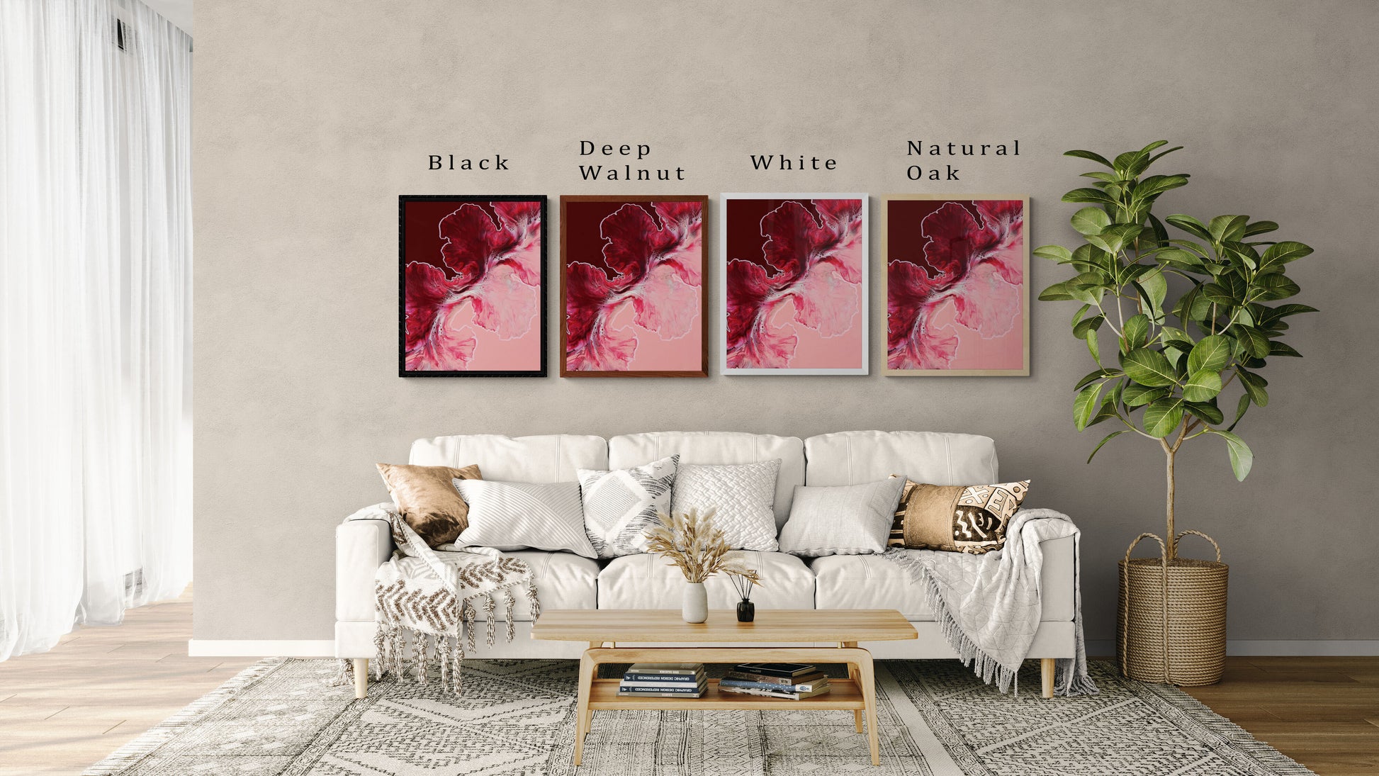 Four framed art prints of Abby May Art’s fluid painting “Hold the Line” displayed above a neutral sofa in a modern living room setting. The artwork features flowing deep red, burgundy, and soft blush pink tones. Each print is shown in a different frame color—Black, Deep Walnut, White, and Natural Oak—with clear labels above each frame. The scene includes cozy earth-toned pillows, a light wood coffee table, and a potted plant to help customers visualize how the framed art would look in their home.
