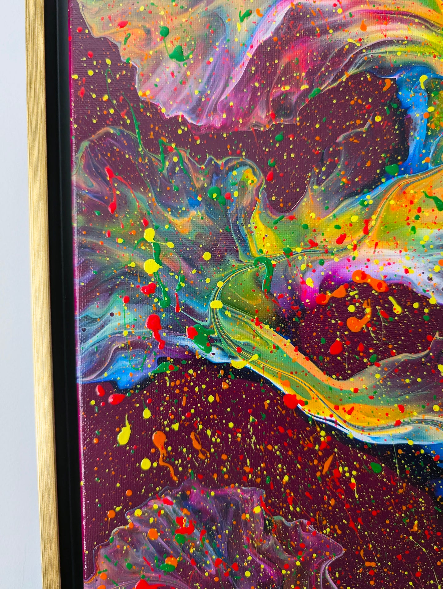 Detailed view of 'I Wish I Had Your Confidence' painting, highlighting bold fluid movements with streaks of bright green and red over a deep magenta background.