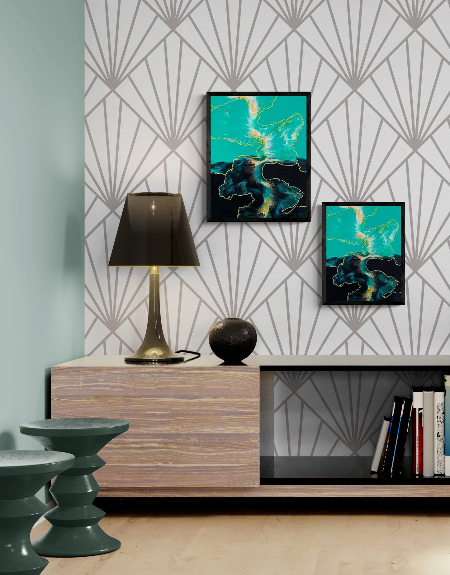 Framed teal and gold fluid art print displayed in a modern living room with geometric patterned wallpaper.