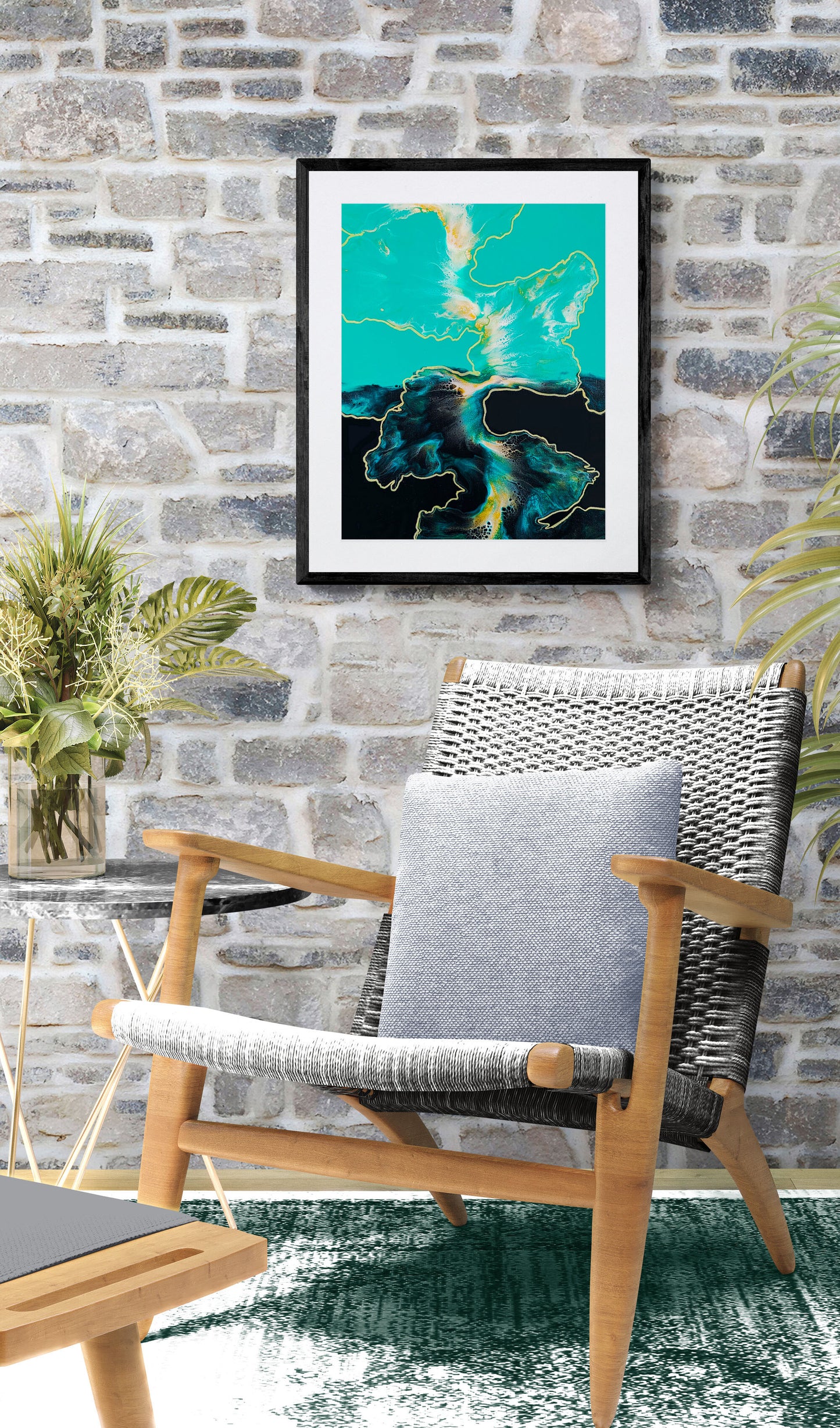 Outside the Lines abstract fluid art print with turquoise, gold, and black tones displayed in a cozy stone-wall living space.