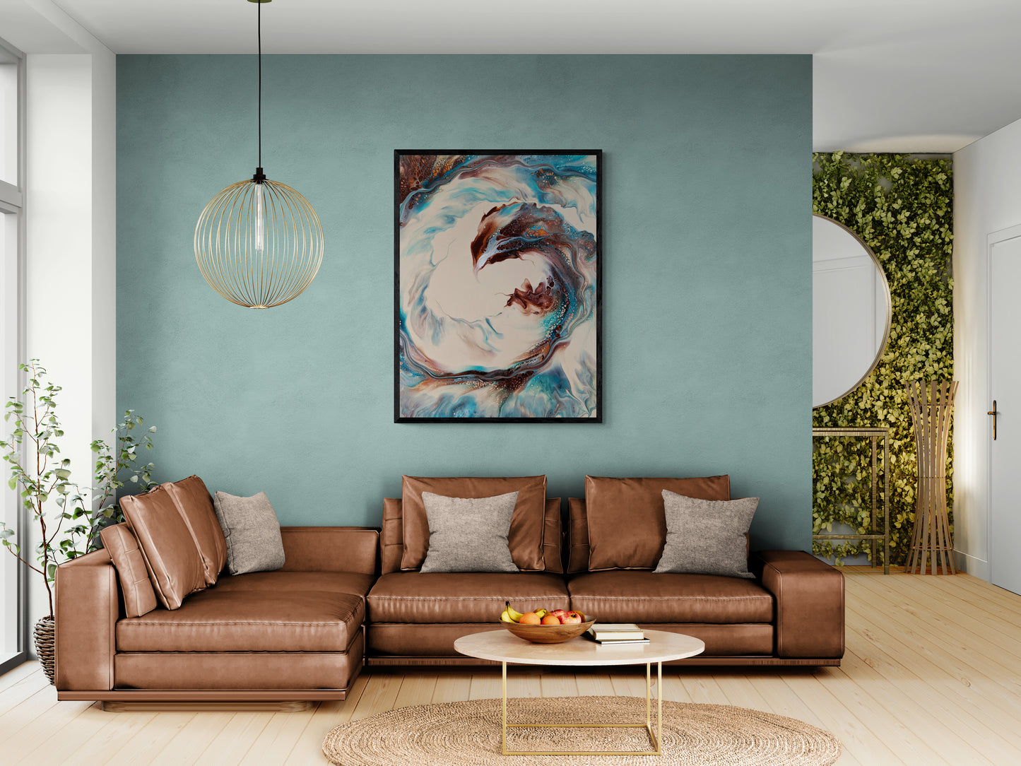 A framed collector’s edition print of “Phoenix” hangs above a tan leather sectional and teal wall. The artwork features swirling fiery copper, turquoise, and cream tones, creating a powerful focal point in the modern living room.