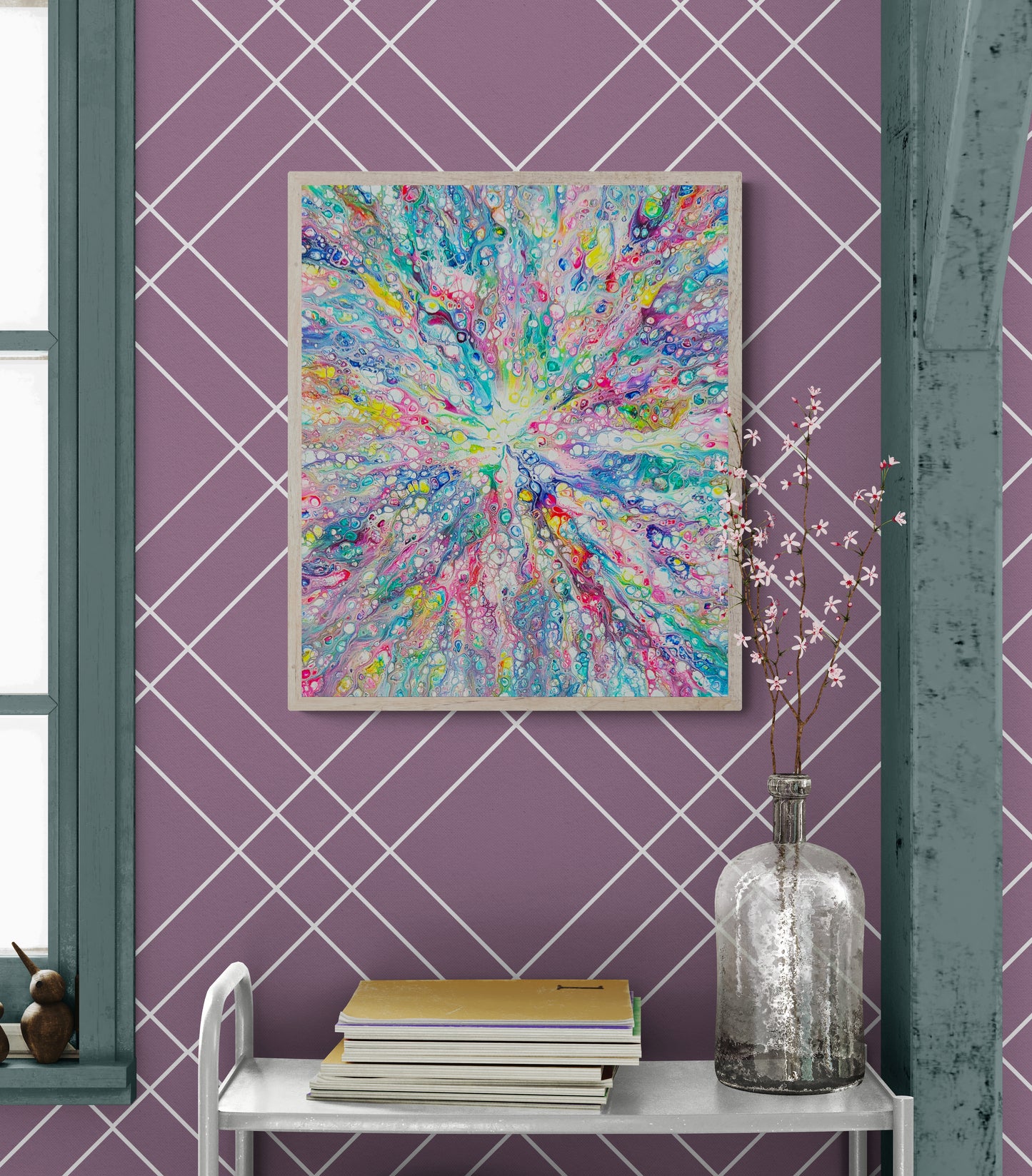 Rainbow Dragon fluid art painting framed in light wood, styled against a rich plum wall with white grid pattern and deep teal trim.