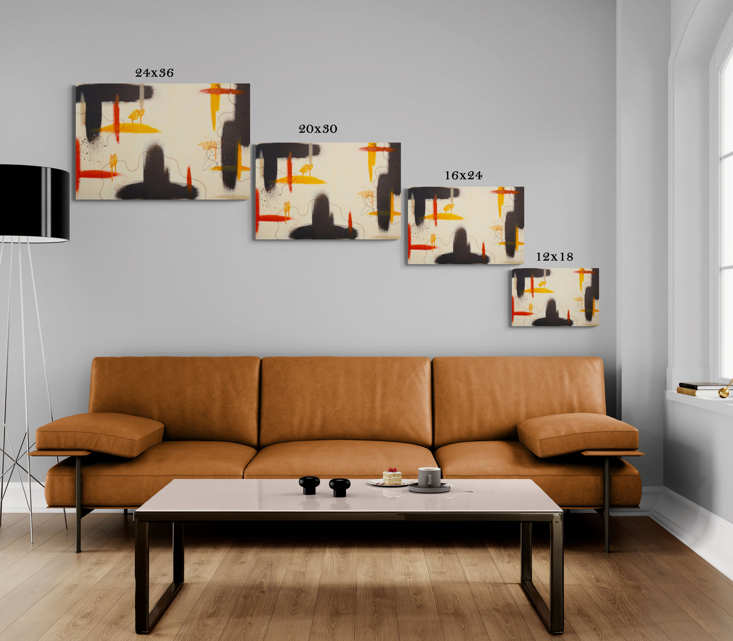 A size comparison guide for the "Silt" abstract canvas print, showing four different scales—24x36, 20x30, 16x24, and 12x18—hanging above a cognac leather sofa in a bright, modern living room. The art features raw umber and warm-toned abstract shapes.