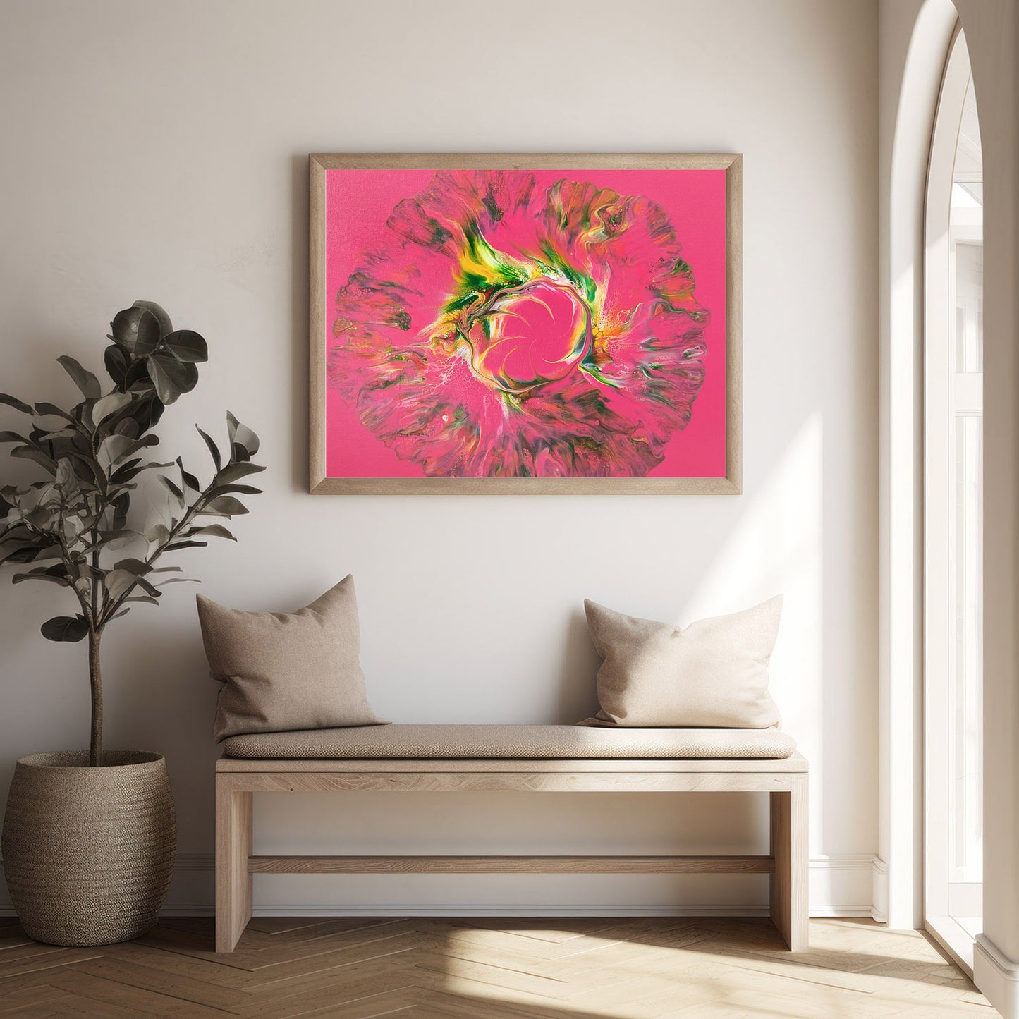 Vibrant pink and green abstract painting titled 'Sprout Out' displayed in a bright, minimal entryway above a light wood bench with neutral cushions. Natural light pours in through a nearby window, enhancing the warm, welcoming atmosphere.