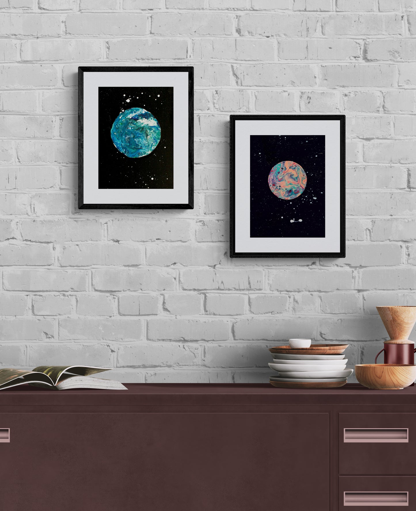 Blue Moon and Strawberry Moon framed prints side by side on a white painted brick wall; styled with stacked dishes and wooden kitchen decor.