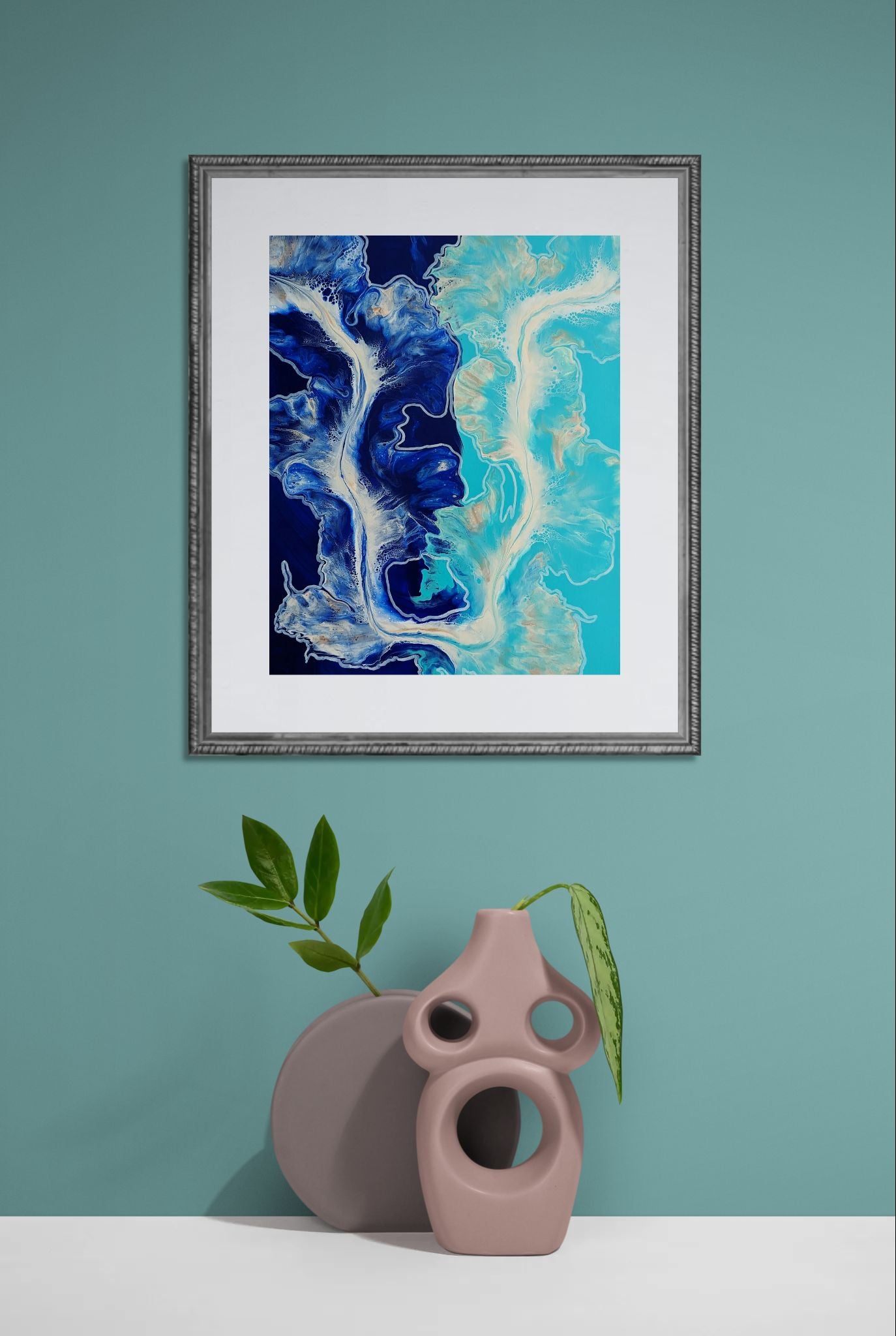The Fine Line – fluid acrylic abstract print in blue and teal tones with flowing white linework, framed wall decor styled with modern sculptural vase.