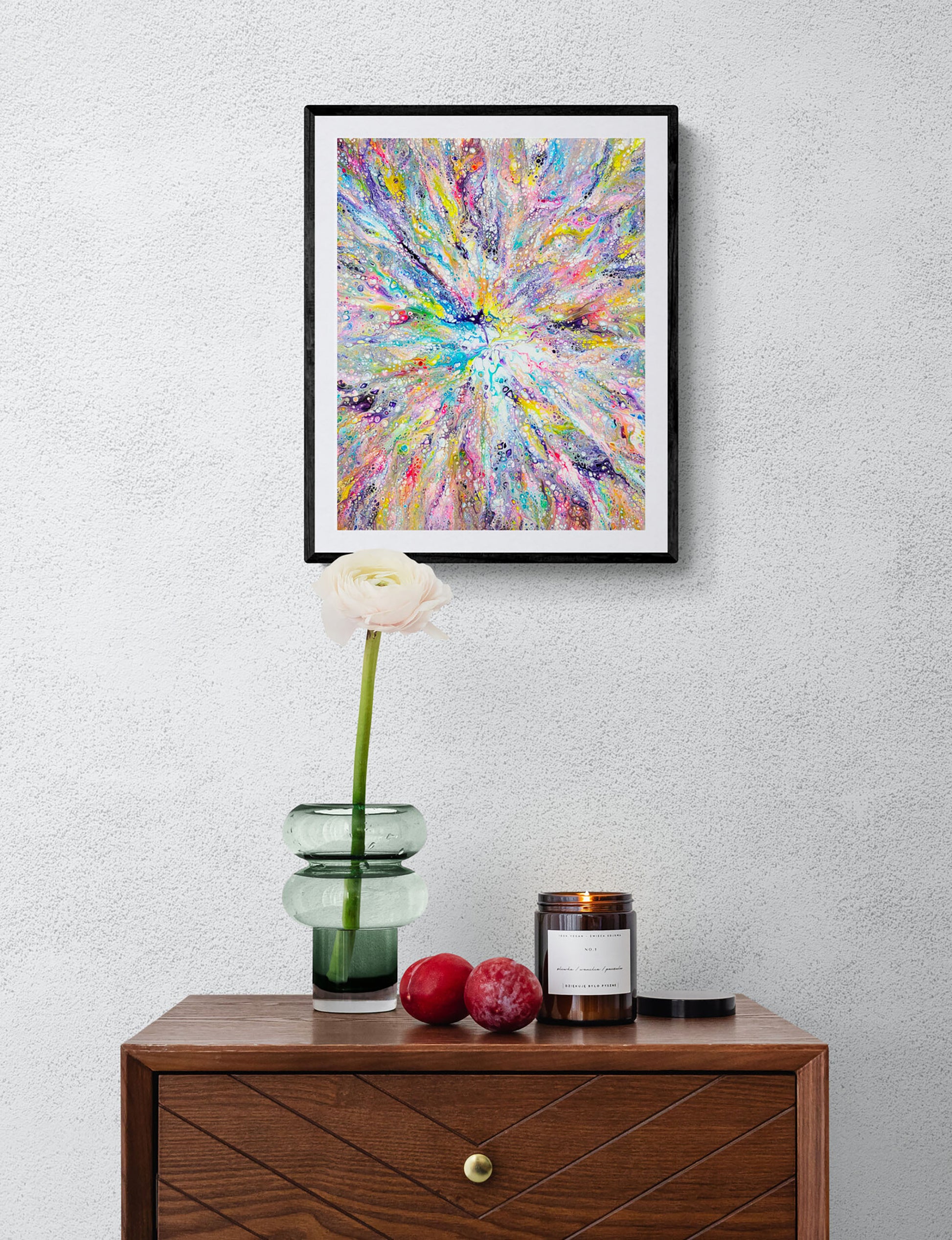 Unicorn – colorful abstract fluid art print in rainbow tones with intricate lacing, framed wall art styled above a wooden console with flower vase and candle.