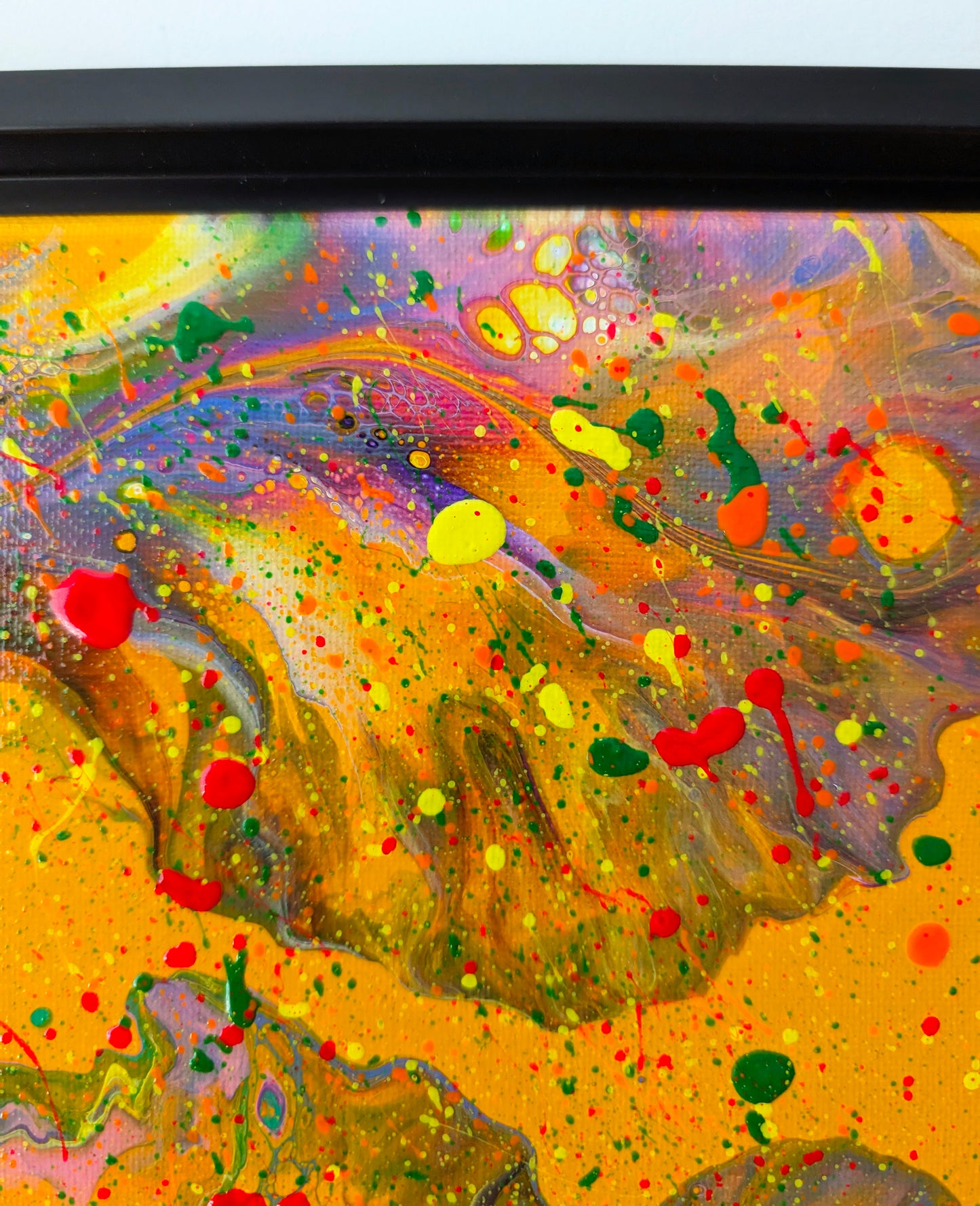 Close-up of the upper section of the painting, highlighting iridescent lavender and violet marbling with bright yellow and red splatters. Small cell patterns and color separations add intricate texture.