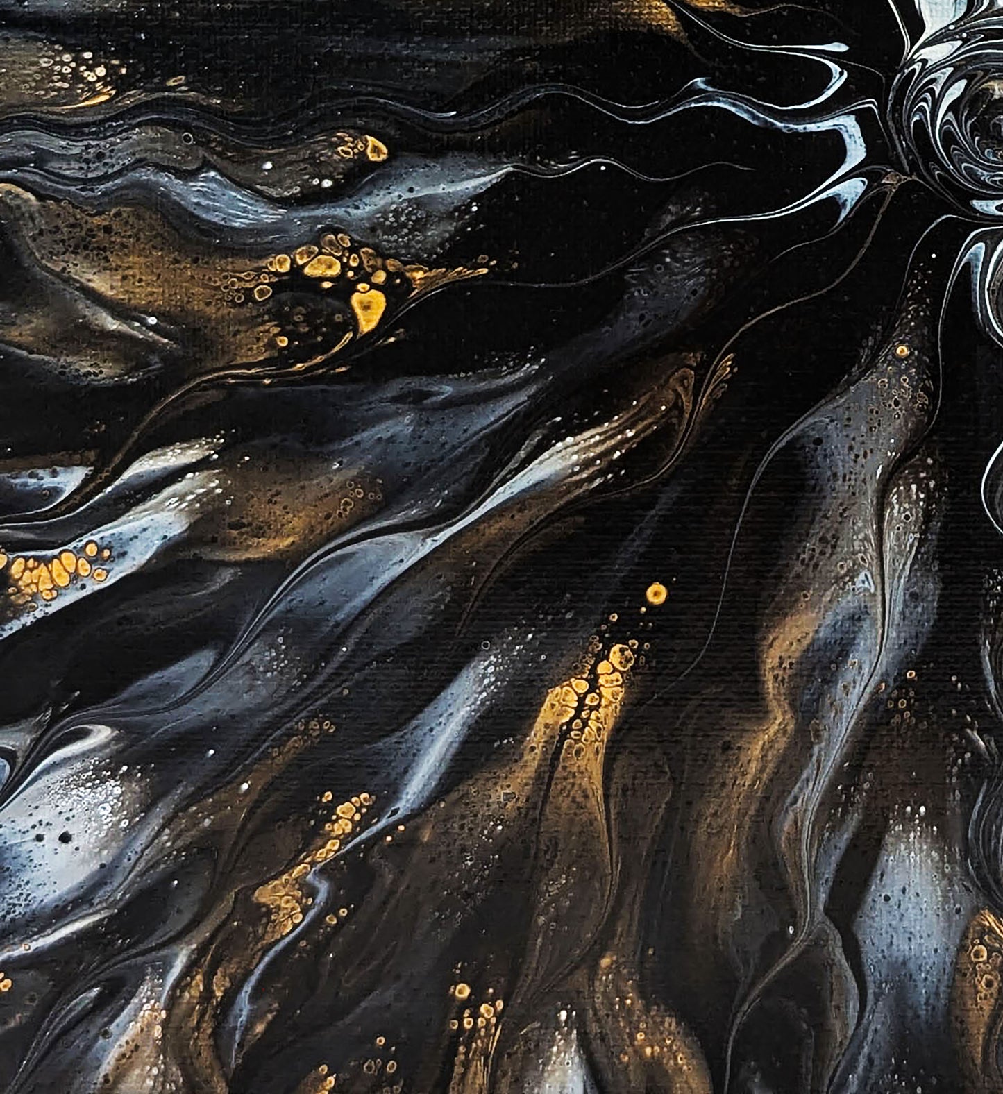 Abstract close-up of Allure, highlighting the shimmering interplay of black, gold, and soft gray waves that ripple outward from the center.