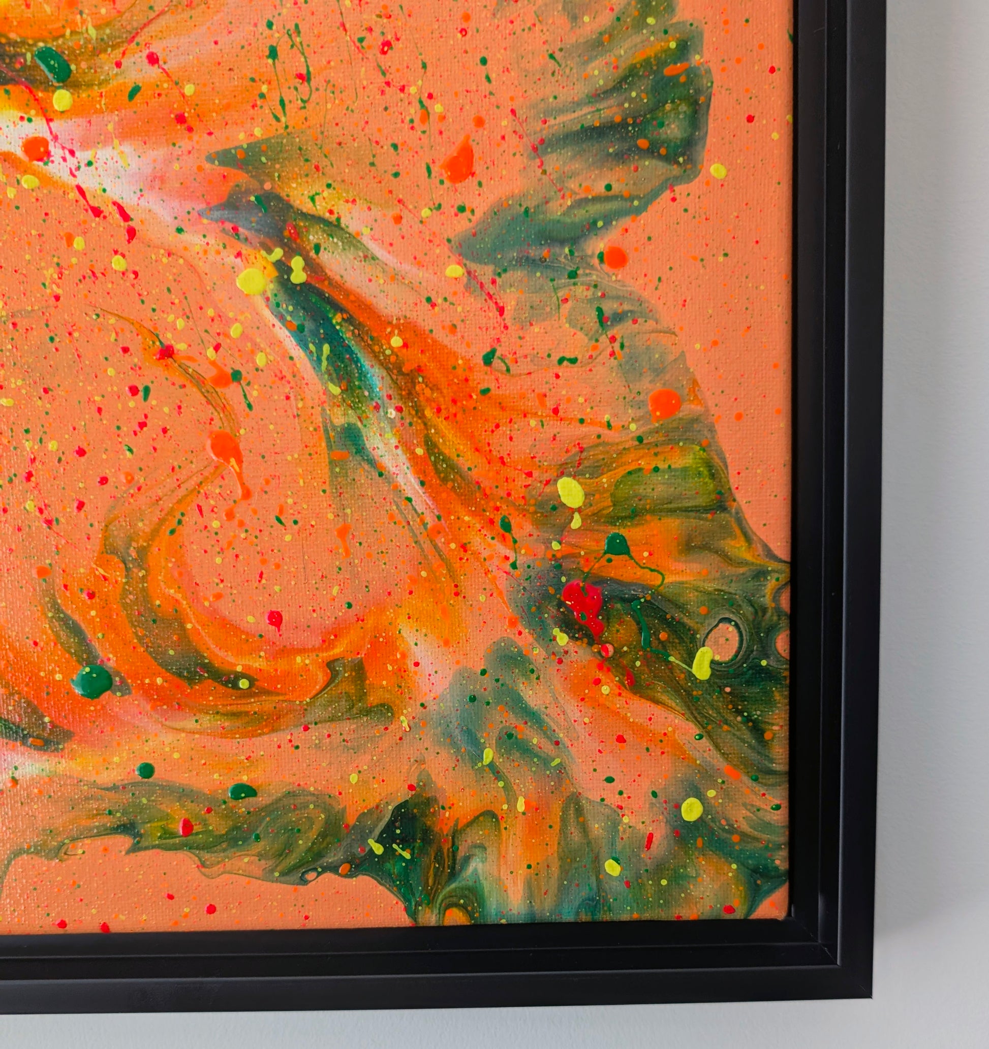 Close-up of 'Are You Really Going Out in That?' painting showing dynamic green and orange swirls blending into a vivid orange base, with bright yellow and red splatter details.