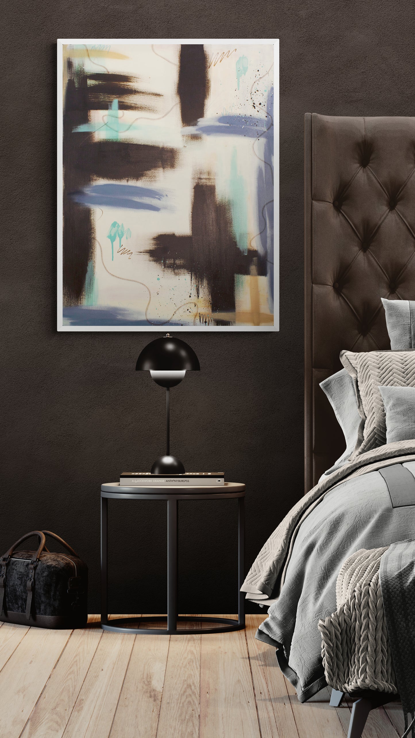 A vertical, unframed abstract painting titled "Between the Layers" hangs on a dark, textured charcoal wall. The piece features heavy strokes of raw umber and teal, with lavender and light blue horizontal bands and thin, wandering oil pastel lines. It sits above a round black nightstand with a modern dome lamp.