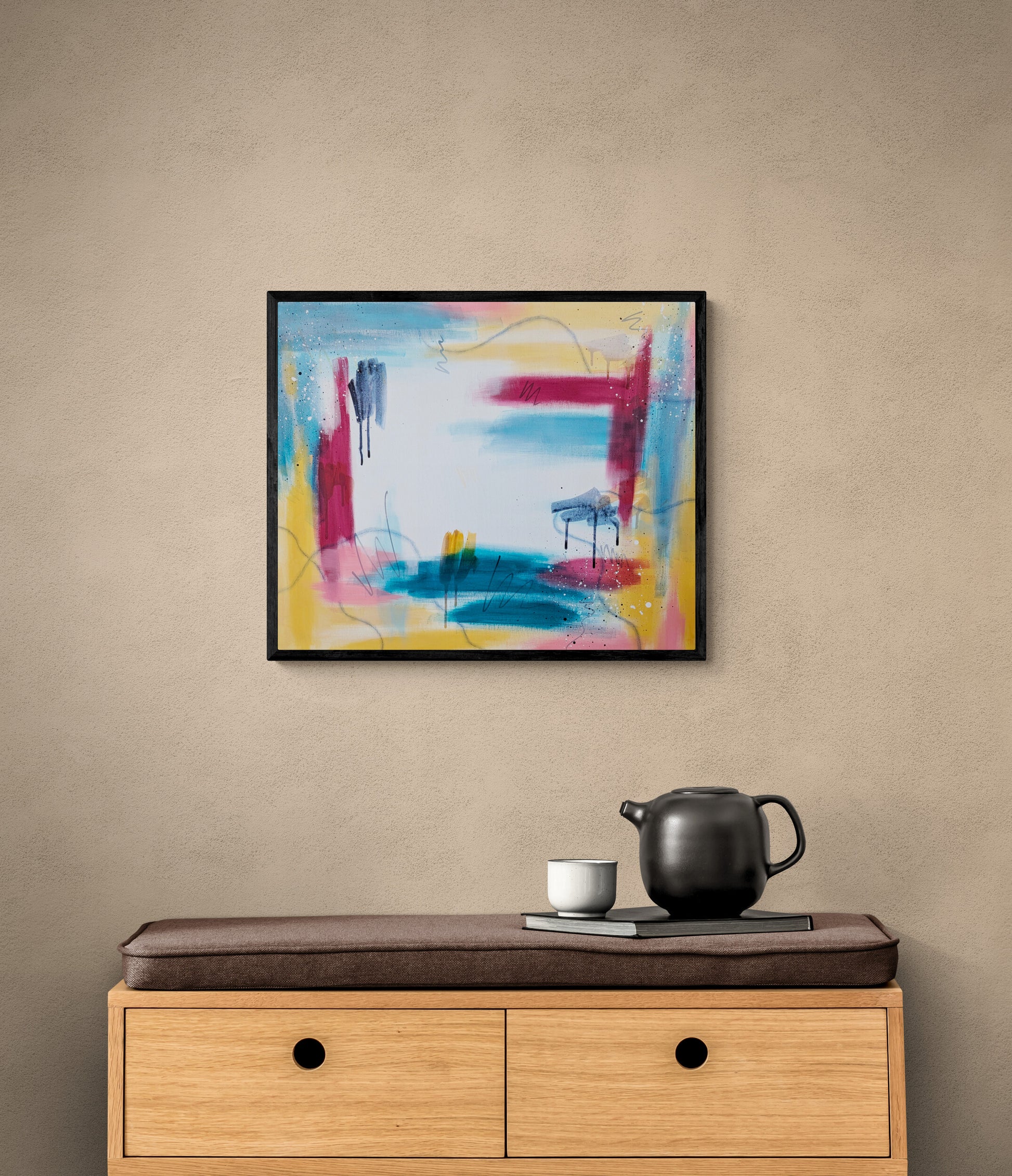 Bright Horizons, an original abstract acrylic painting by Abby May, framed above a wooden cabinet in a calm, minimalist interior