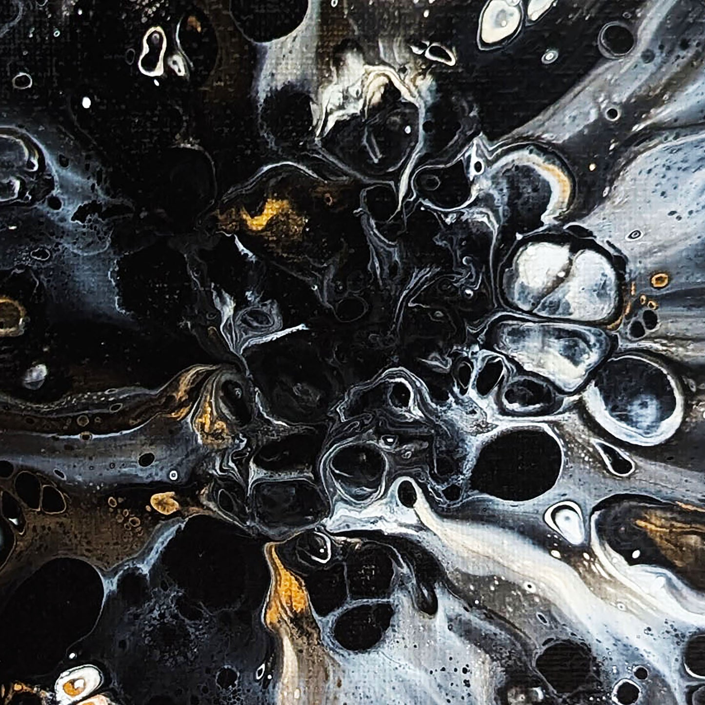 Close-up detail of Abby May’s abstract painting Charm, featuring swirling black and metallic gold forms that converge into a dark, textured center.