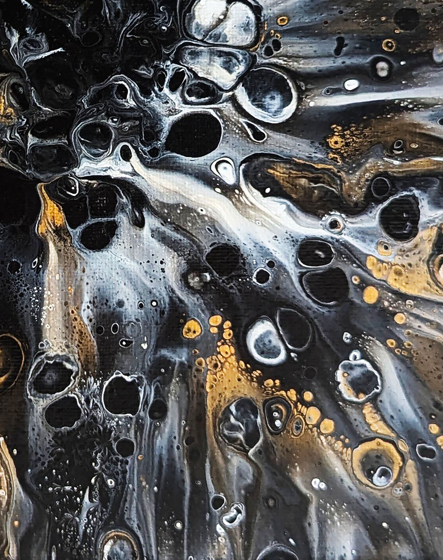 Macro texture from Charm by Abby May, showing dynamic black and gold bubbles and smooth white veining that evoke both energy and elegance.