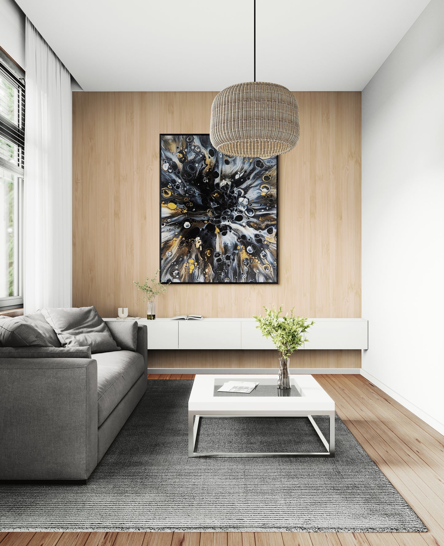 Framed Charm print by Abby May hanging above a gray sofa in a light-filled living room. The gold, black, and white layers add warmth and elegance to the minimalist decor.