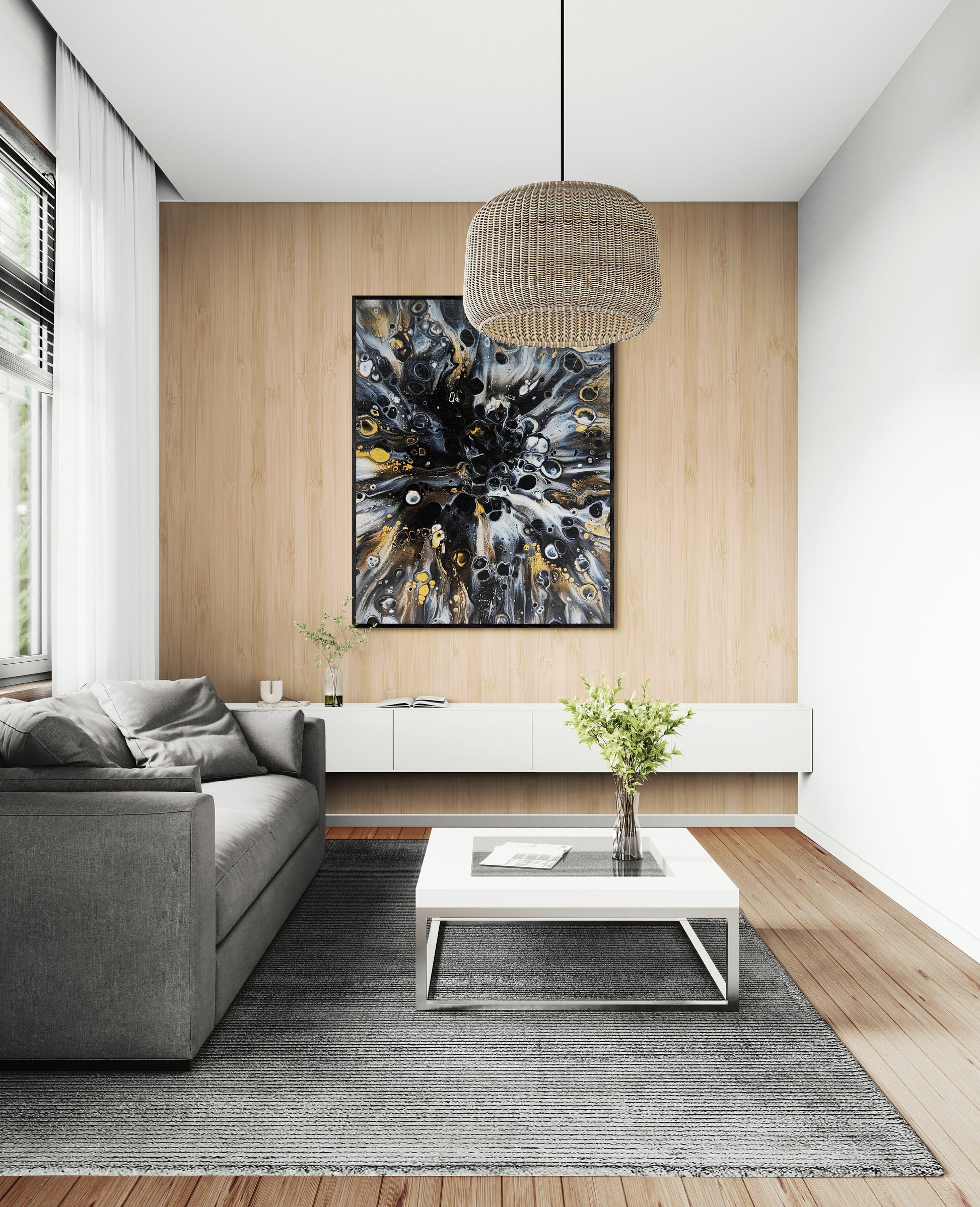 Framed Charm print by Abby May hanging above a gray sofa in a light-filled living room. The gold, black, and white layers add warmth and elegance to the minimalist decor.