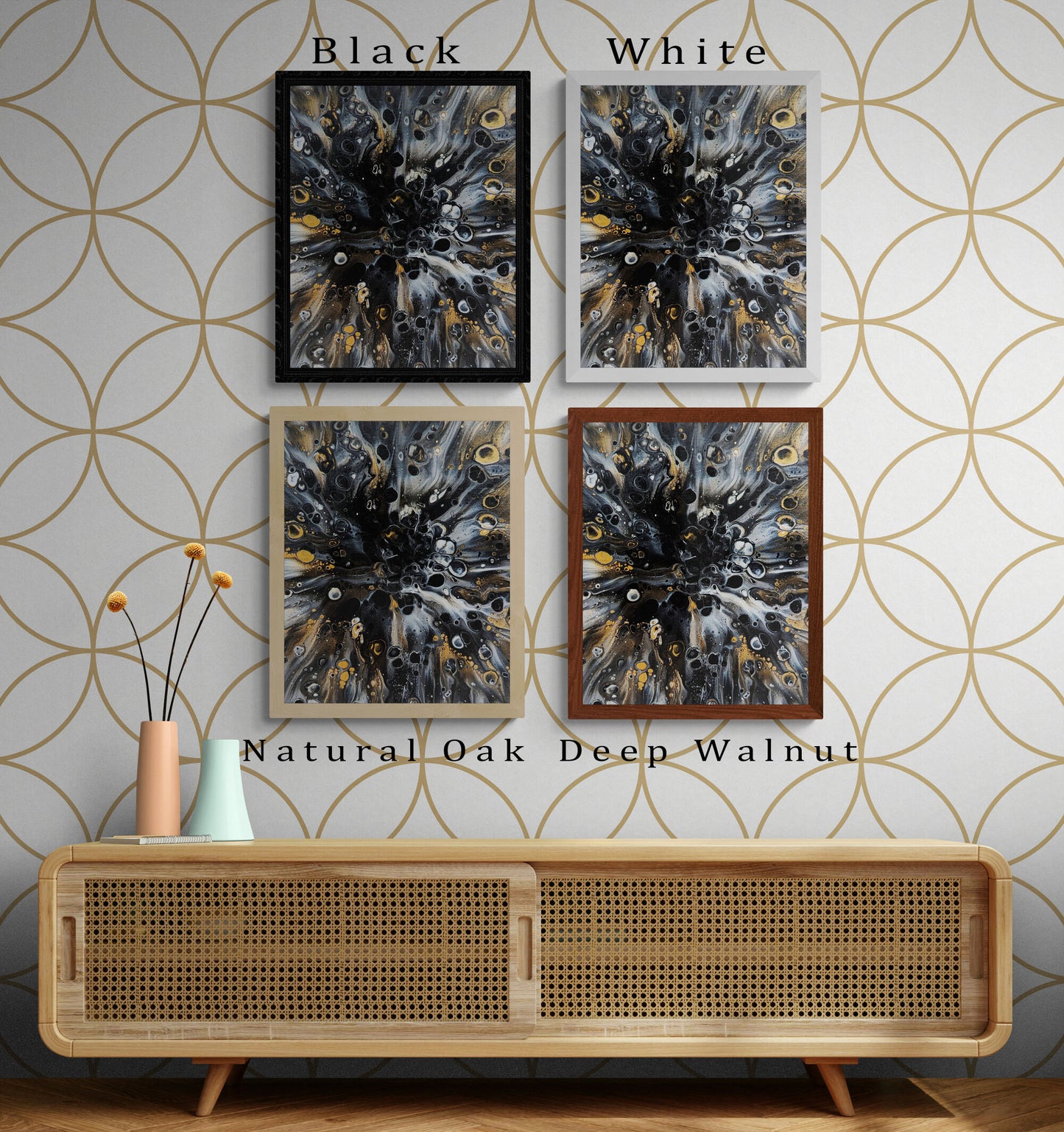 Abstract fluid art prints shown in four frame colors—black, white, natural oak, and deep walnut—arranged above a cane wood console with geometric wallpaper
