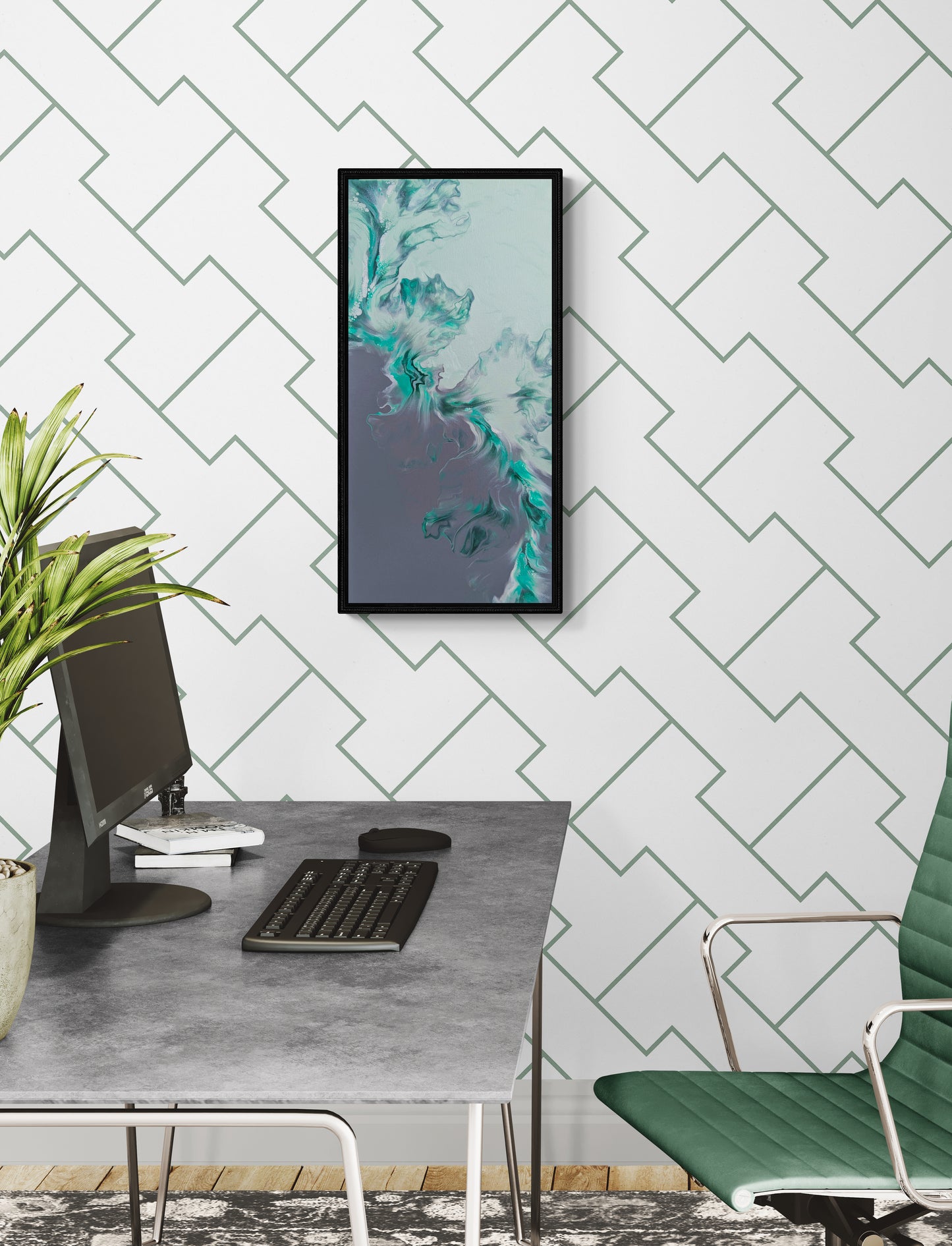 Climbing fluid art painting framed in black, styled in a modern office with a white geometric wall, grey desk, and green chair.