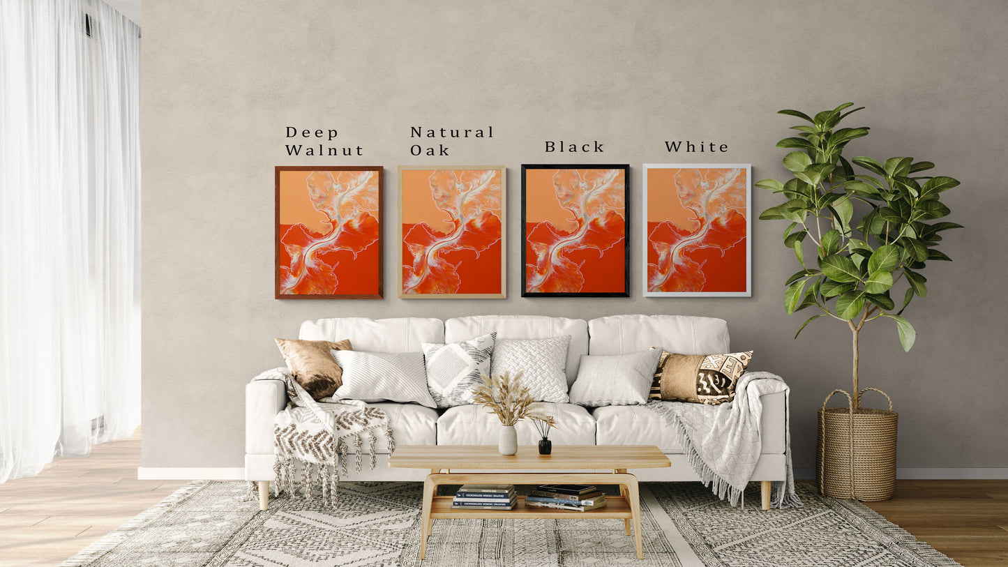 Four framed prints of Abby May Art’s fluid painting “Cross the Line” displayed above a modern cream-colored sofa in a neutral living room. The artwork features rich orange and warm peach tones with white fluid movement flowing vertically through the center. Each frame showcases a different color option—Deep Walnut, Natural Oak, Black, and White—with labels above each frame. Cozy throw pillows, a light wood coffee table, and a tall potted plant complete the home setting, helping viewers imagine how the art w