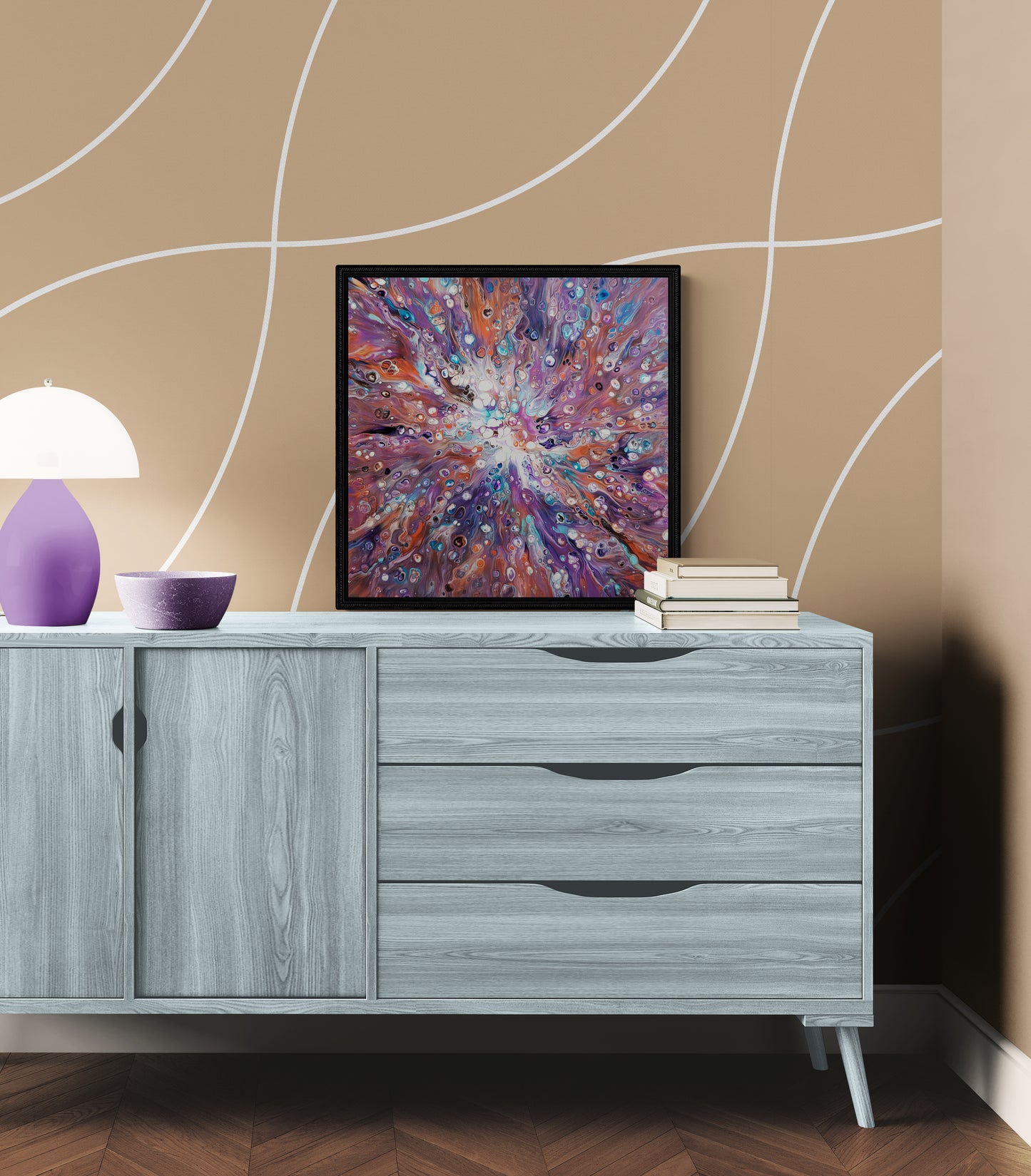 Elusive Kitsune fluid art painting framed in black, styled on a light gray wood sideboard with a warm beige curved pattern wall, soft violet lamp, and neutral home decor.