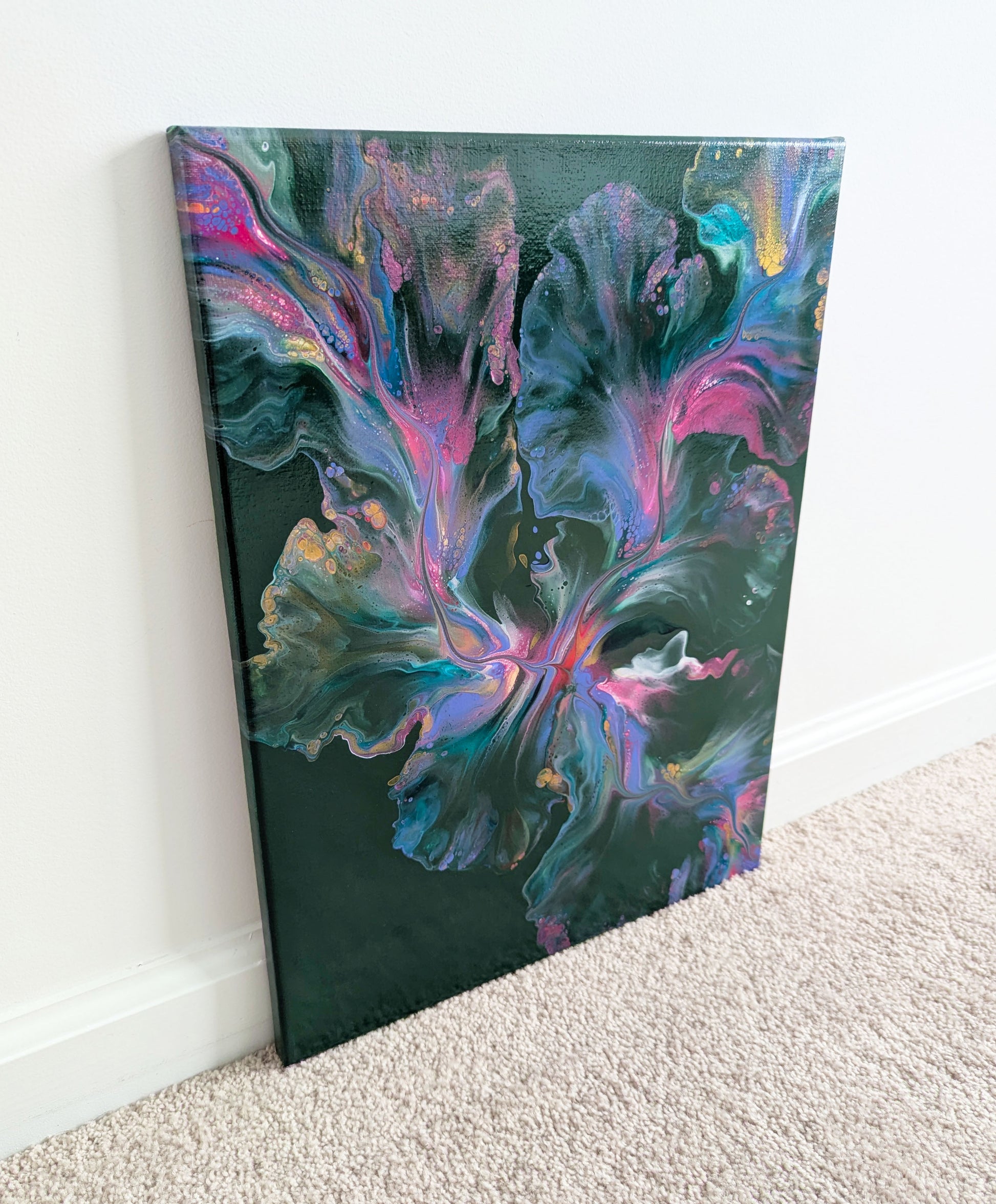 A dreamy abstract fluid painting titled 'Enchanted Sky,' showcasing a lush green background with soft blends of pinks and purples. The organic movement of color creates a magical and ethereal sky-like effect