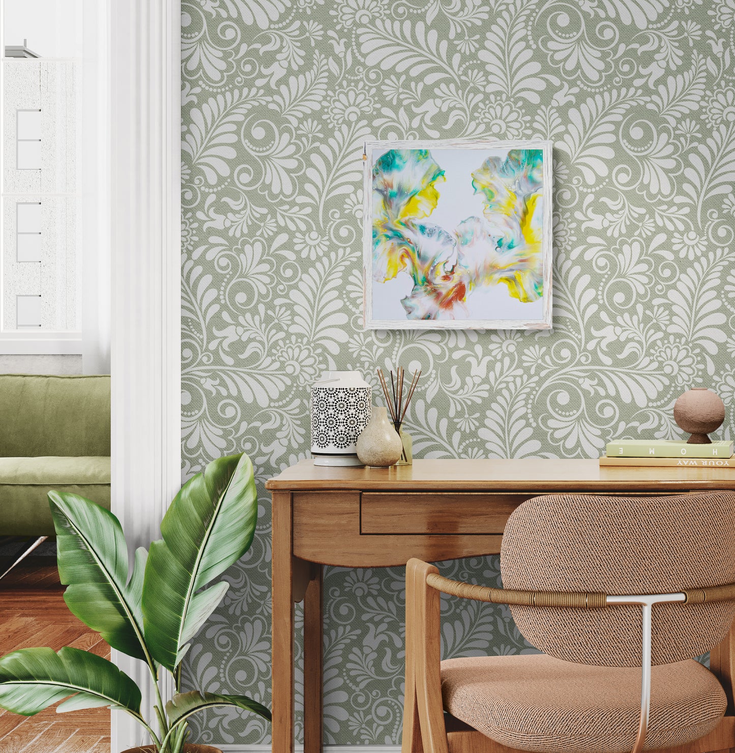 First Daffodils of Spring fluid art painting framed in rustic white, styled above a wooden desk with leafy green wallpaper and neutral decor
