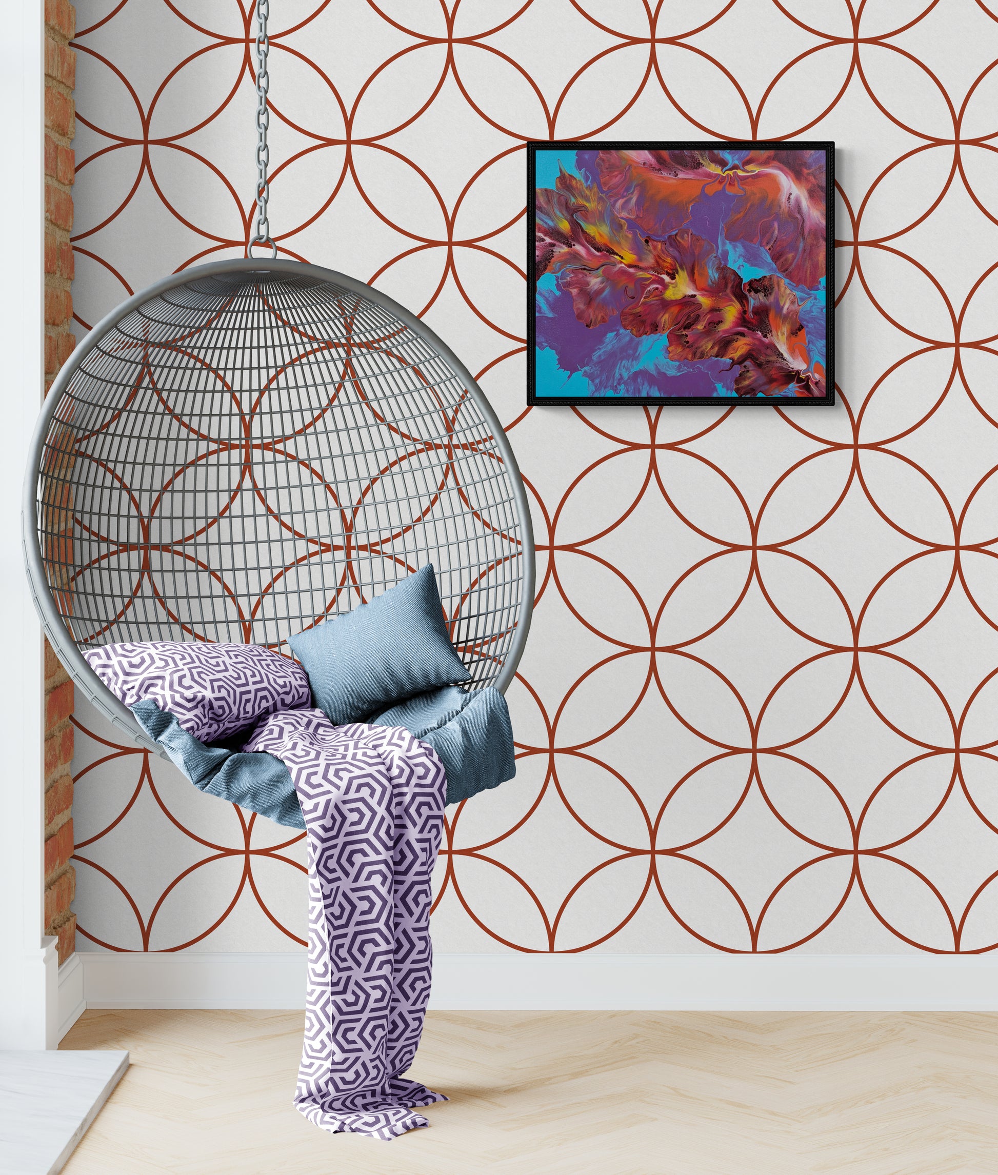 Flames in Bloom fluid art painting in a black frame, styled in a modern loft with graphic wallpaper and a metal hanging chair.