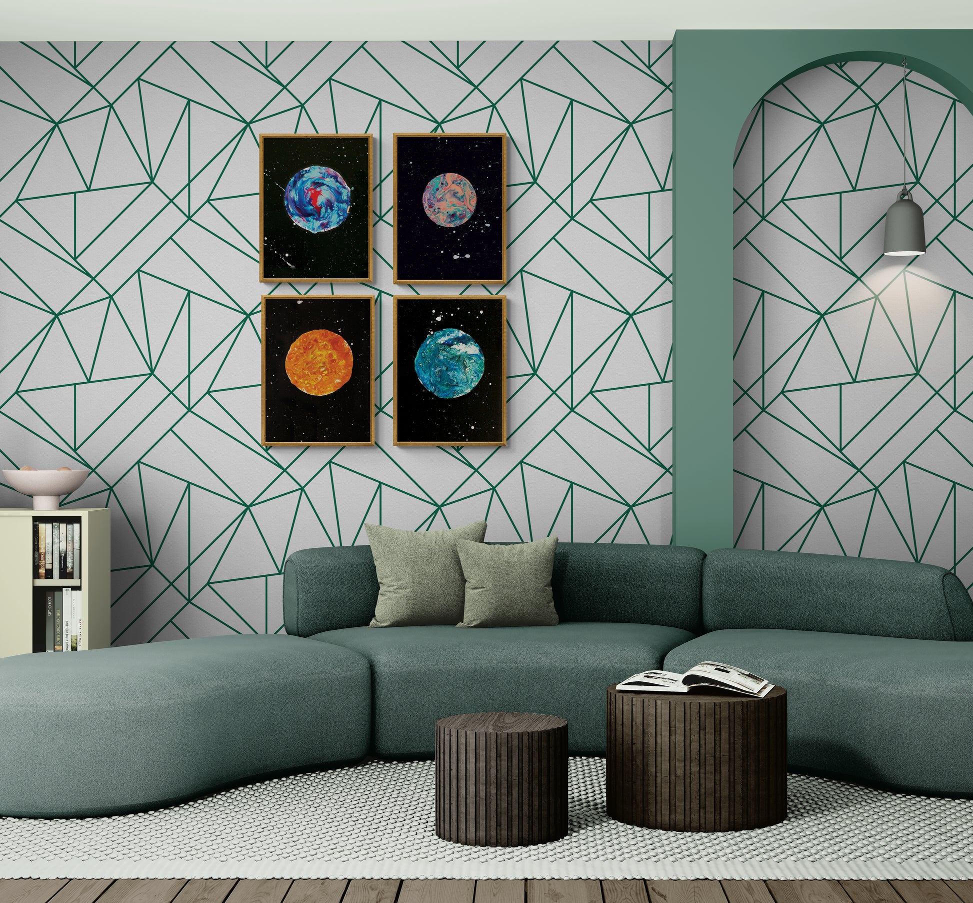 Set of four framed moon art prints arranged in a 2x2 grid above a sage green sofa with geometric wallpaper
