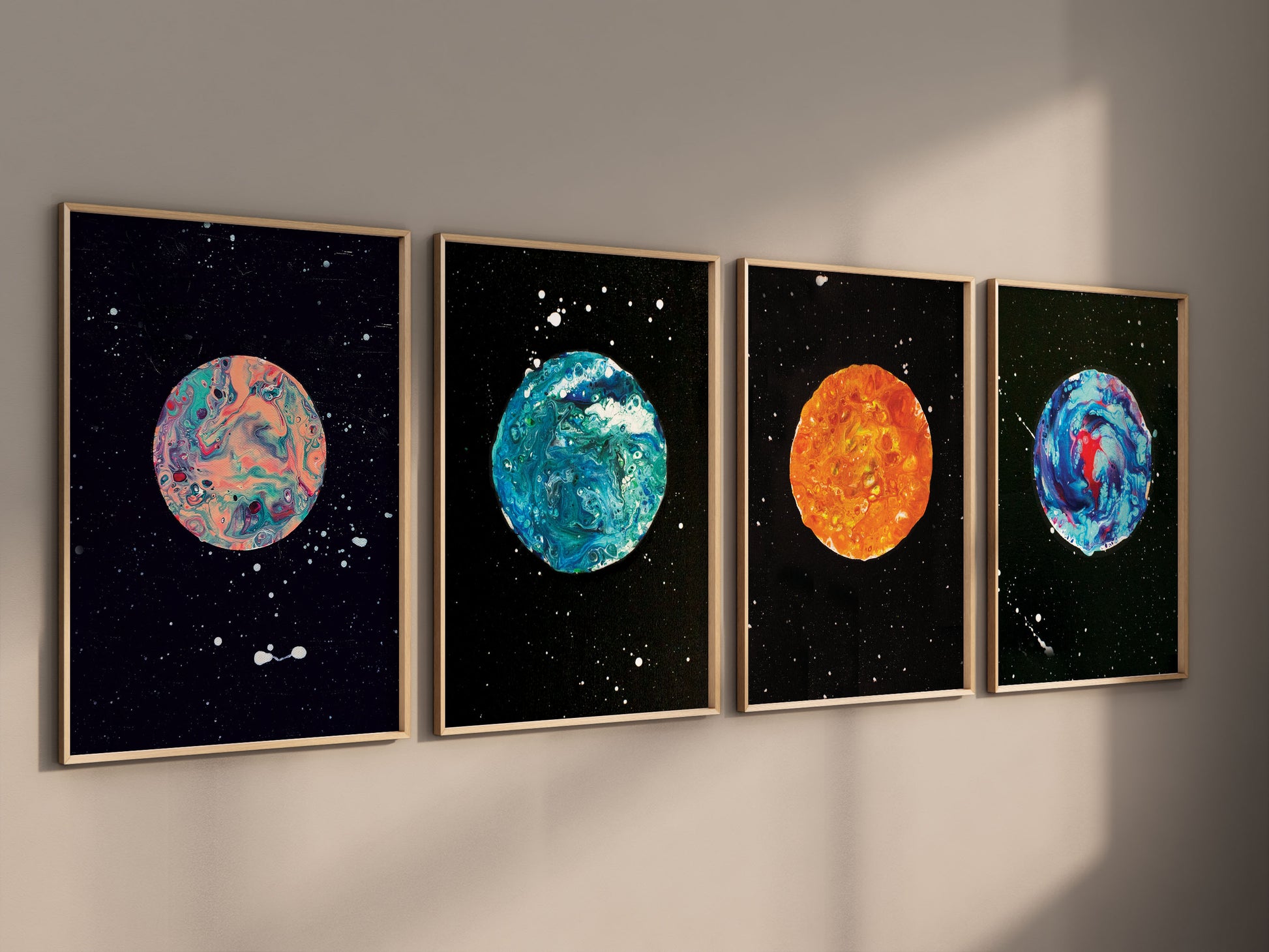 Side view of framed moon art prints on a neutral wall, shown in warm light with visible shadows