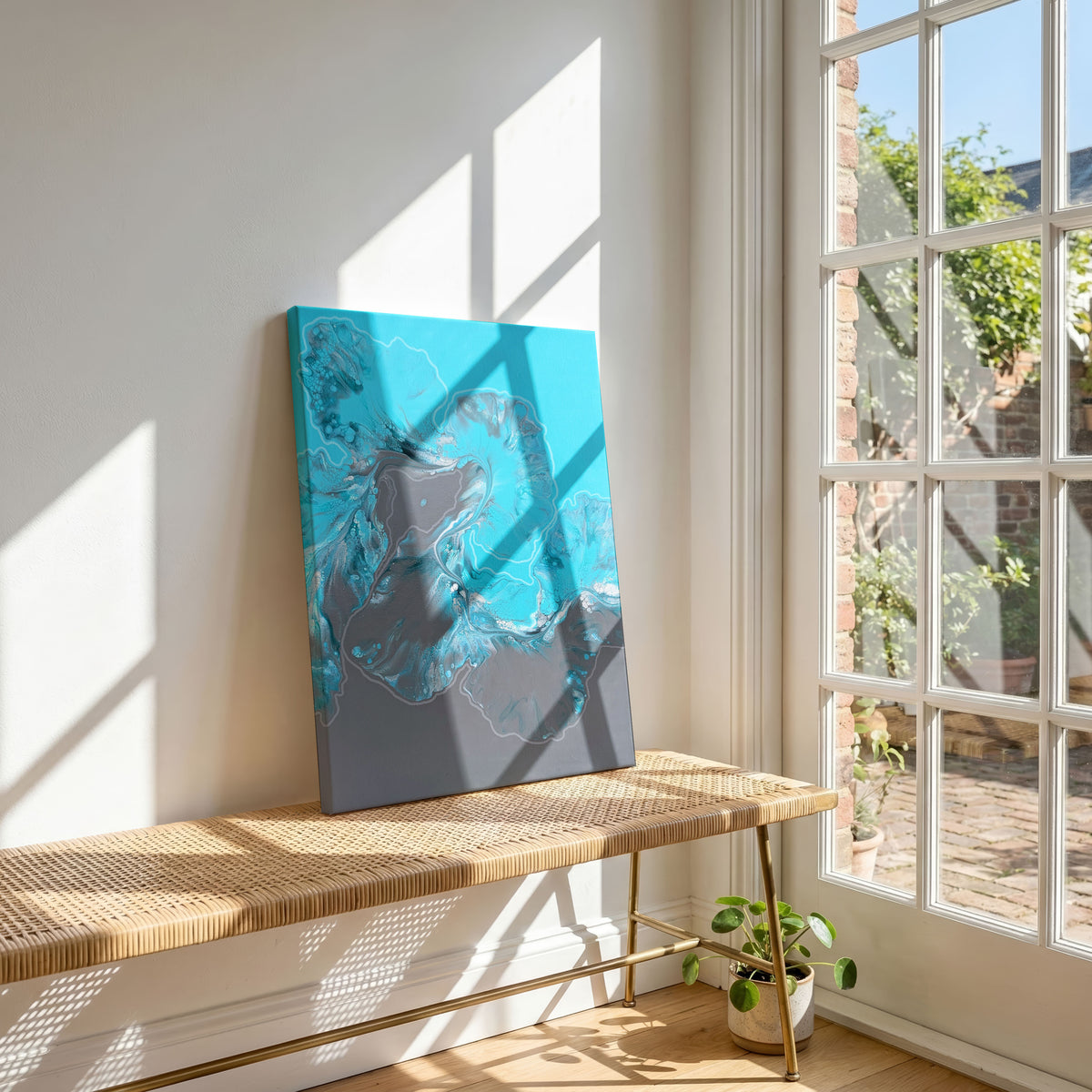 Angle view of Glacier, an original fluid painting by Abby May, shown in a room leaning on a bench beside a window, with the canvas edge visible.