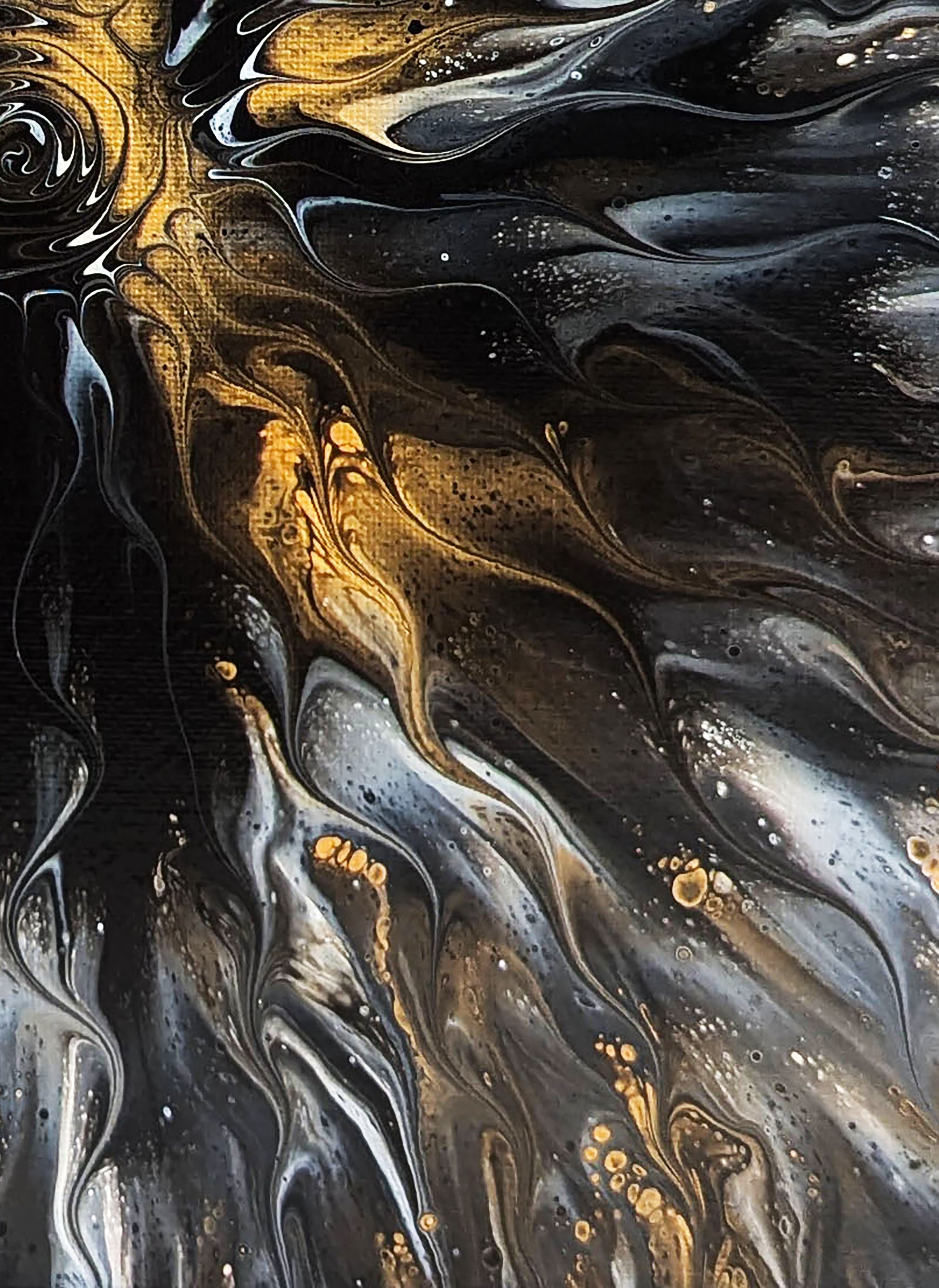 Section of Abby May’s Glitz painting showing the sweeping, flame-like flow of black, gray, and gold tones, with delicate specks that resemble stars or embers.