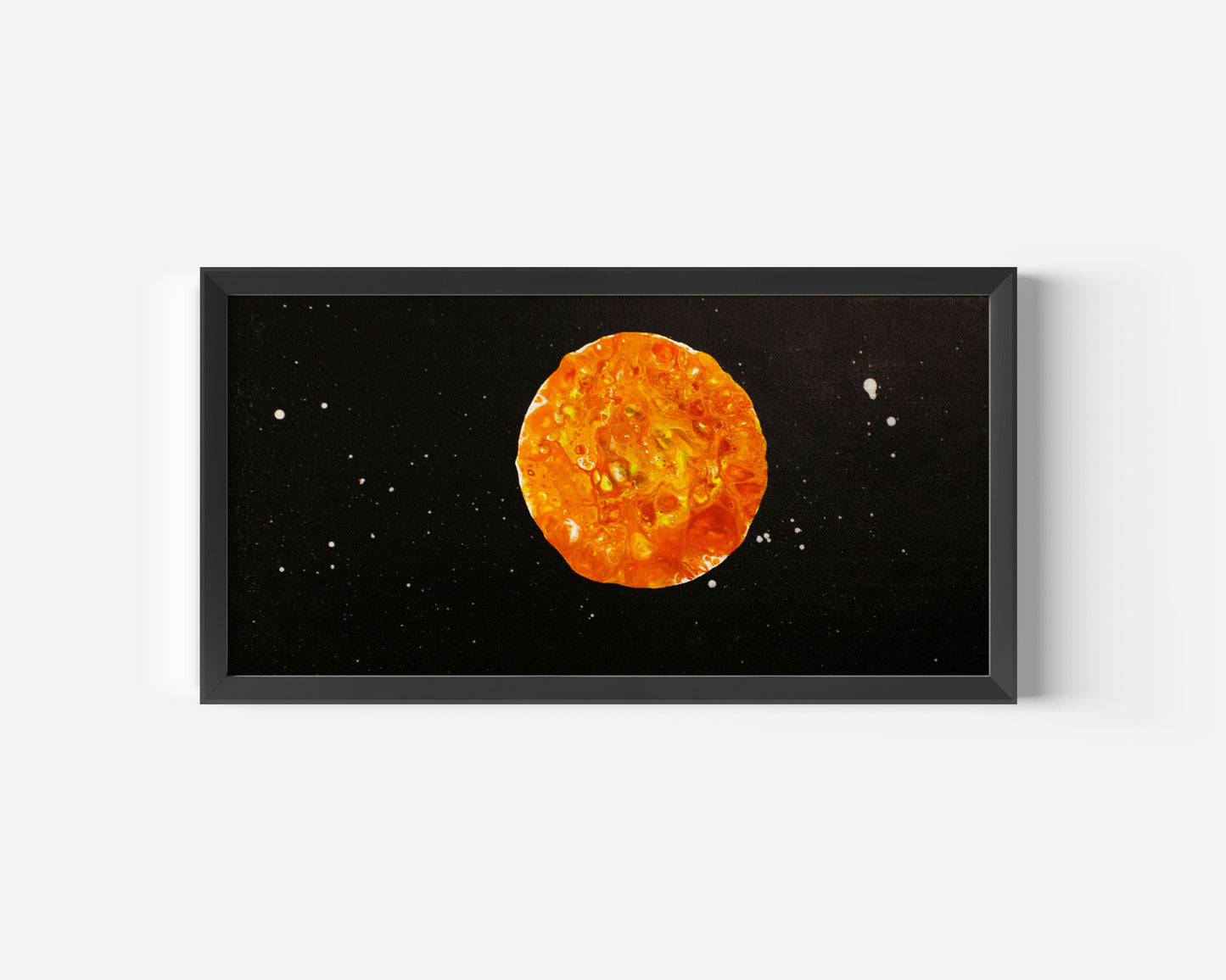 Close-up view of the framed Harvest Moon abstract canvas painting featuring glowing orange and yellow tones on a black star-speckled background.