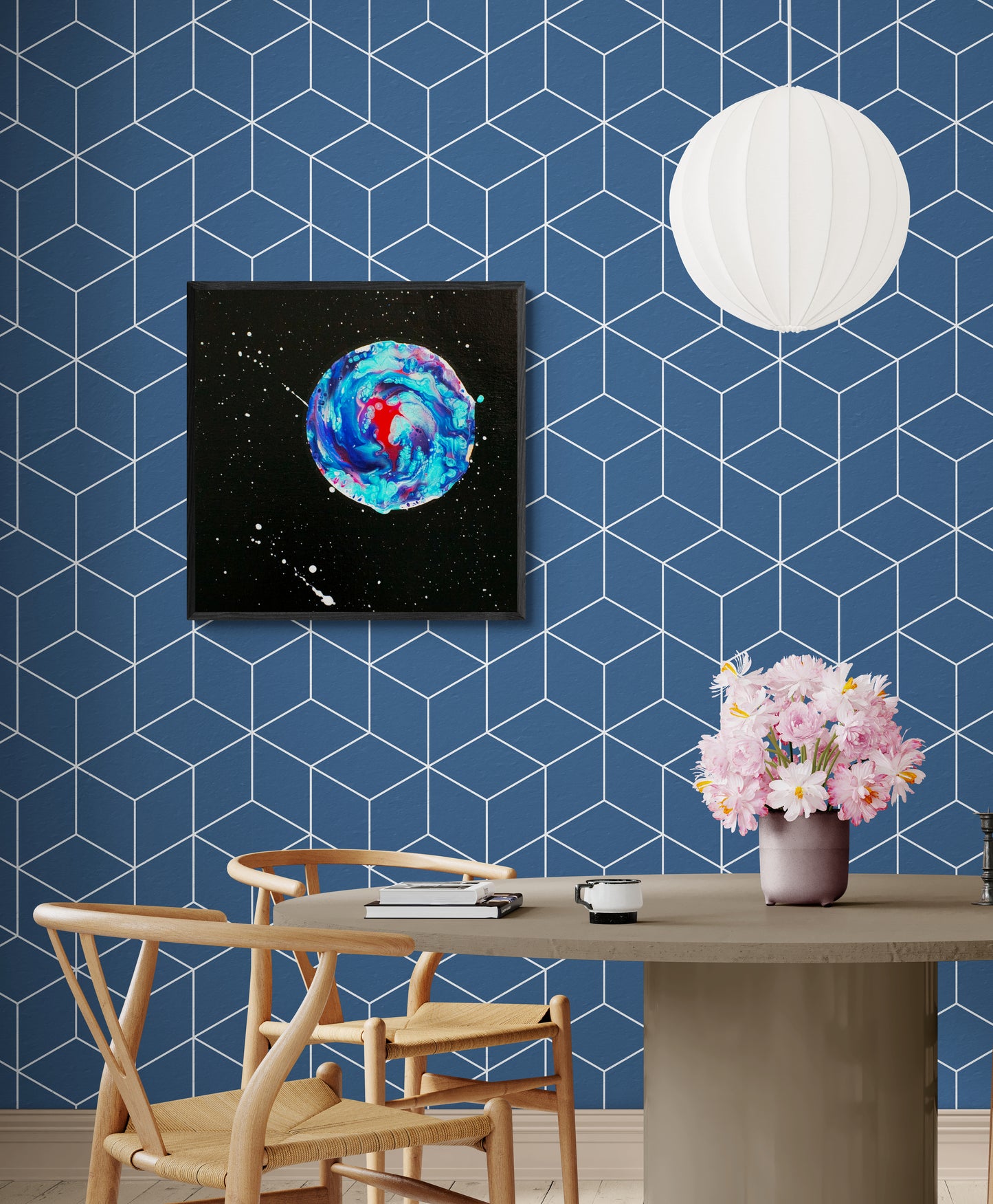 Her Majesty the Moon framed canvas against geometric blue wall above a dining table with a floral centerpiece.
