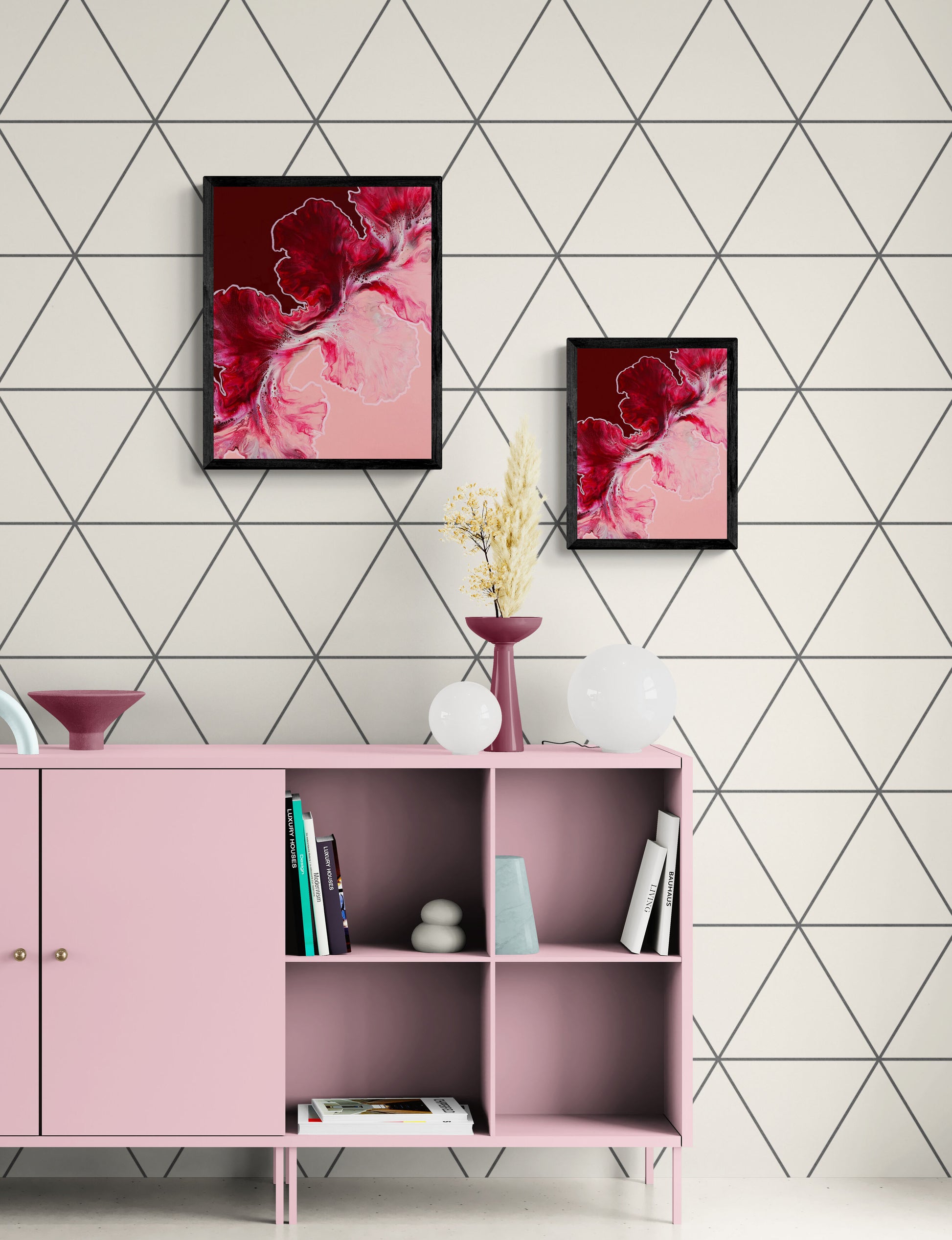 Pair of Hold the Line abstract prints in burgundy and blush tones, displayed on modern console with geometric wallpaper.