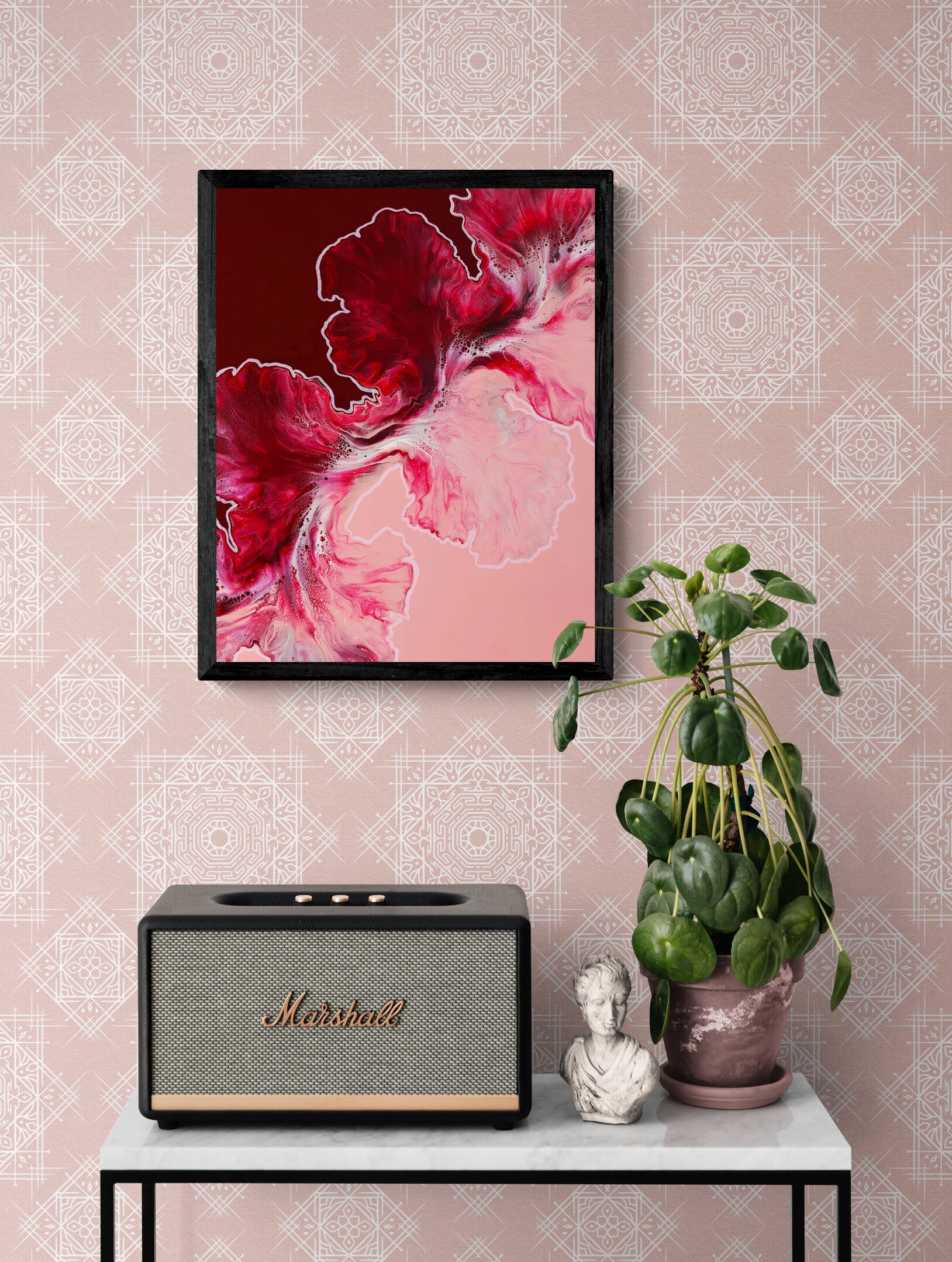 Abstract fluid art print Hold the Line, framed and styled with pink patterned wallpaper and houseplant decor.