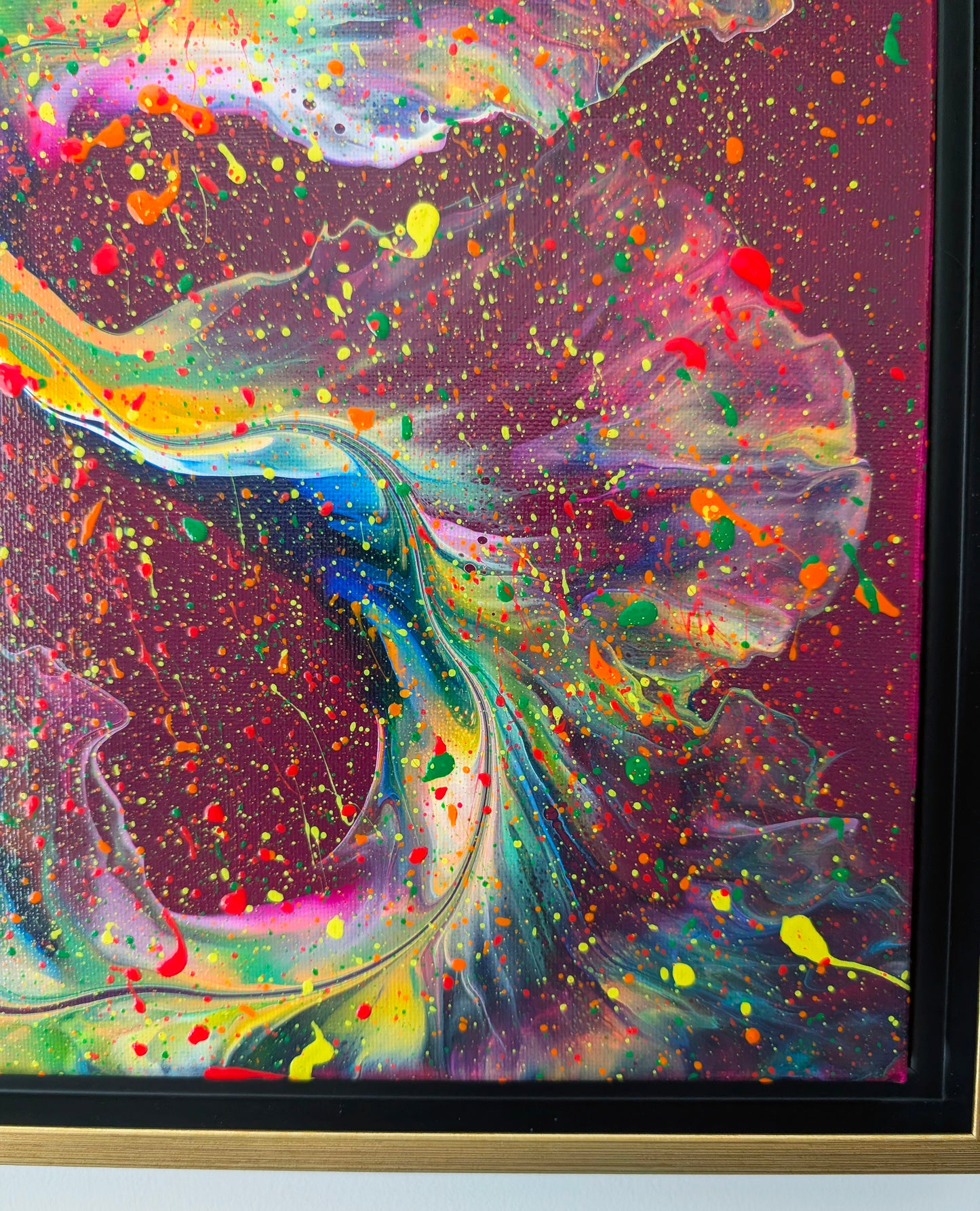 Close-up of 'I Wish I Had Your Confidence,' showing detailed swirls of neon green, yellow, and pink on a rich magenta base, accented by splatters of orange, red, and yellow.